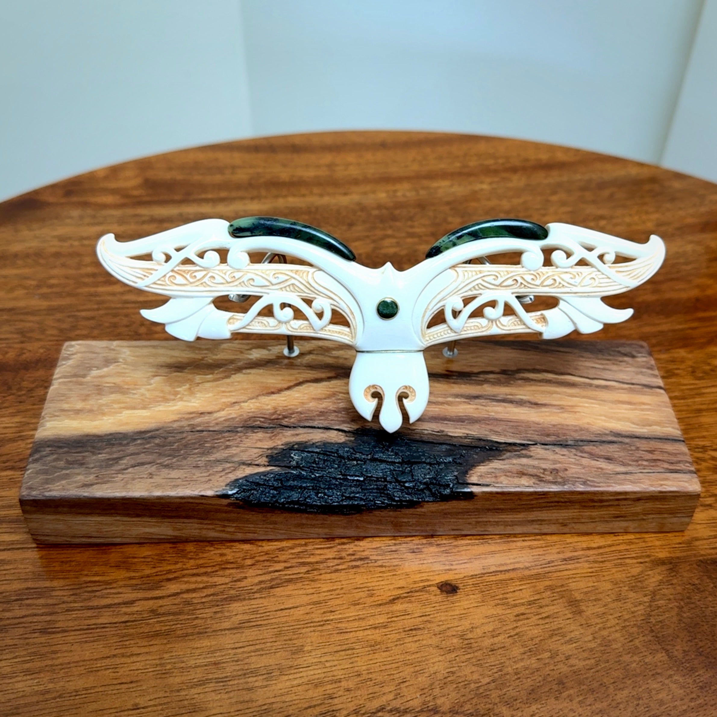 This is a wonderful New Zealand Jade and Bone necklace that can also be displayed as a sculpture with wooden stand.