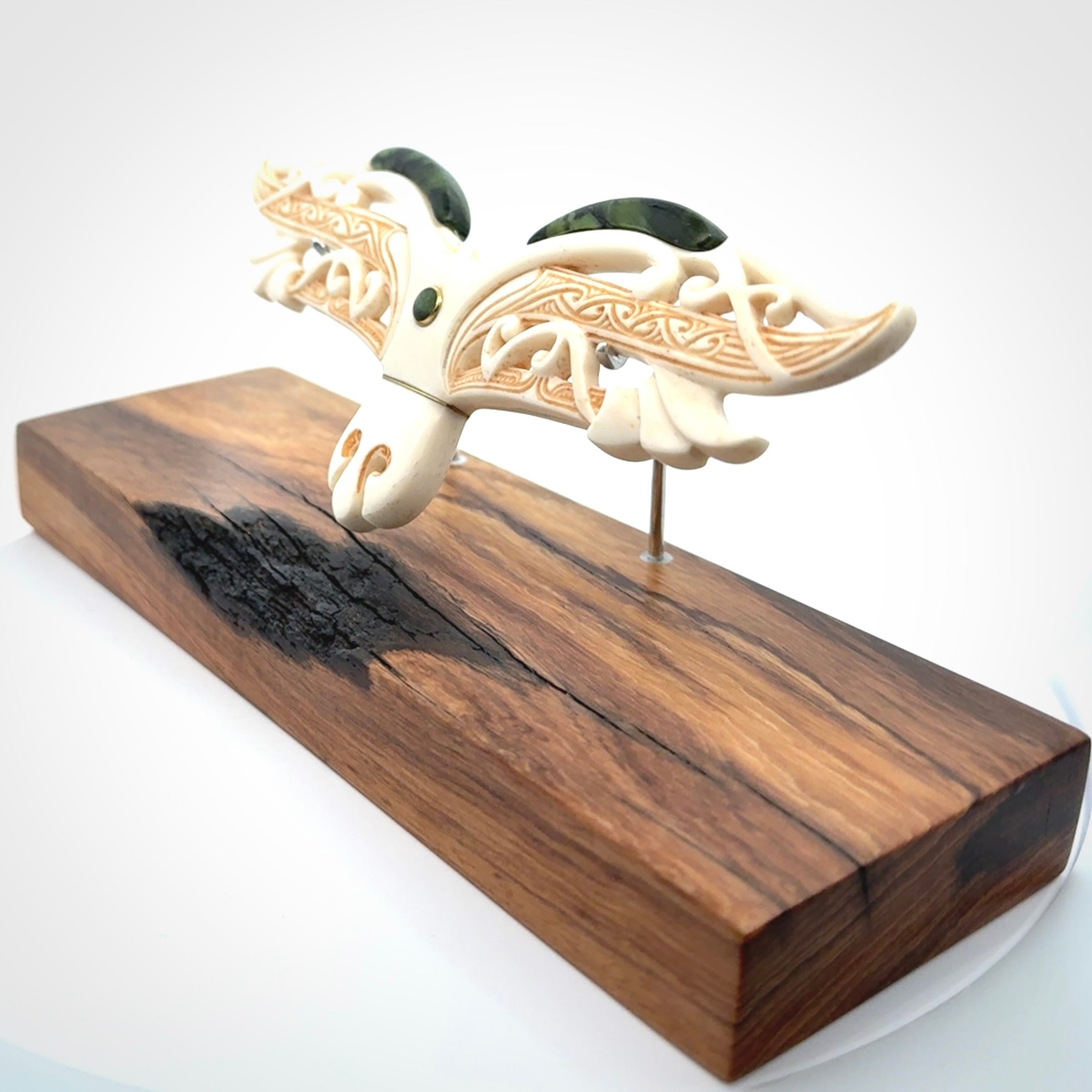 This is a wonderful New Zealand Jade and Bone necklace that can also be displayed as a sculpture with wooden stand.
