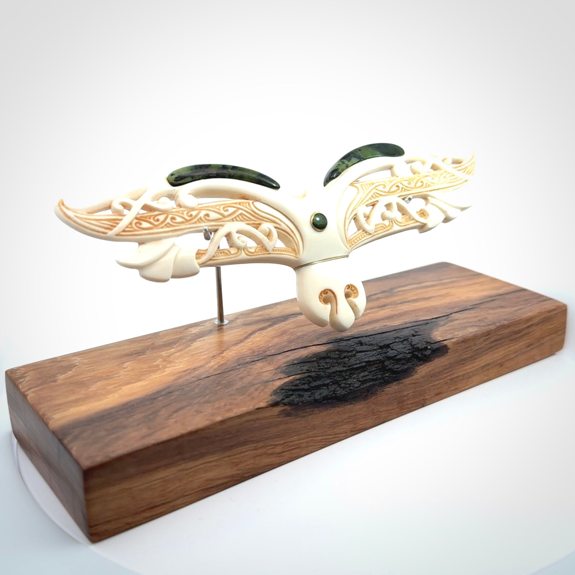 This is a wonderful New Zealand Jade and Bone necklace that can also be displayed as a sculpture with wooden stand.