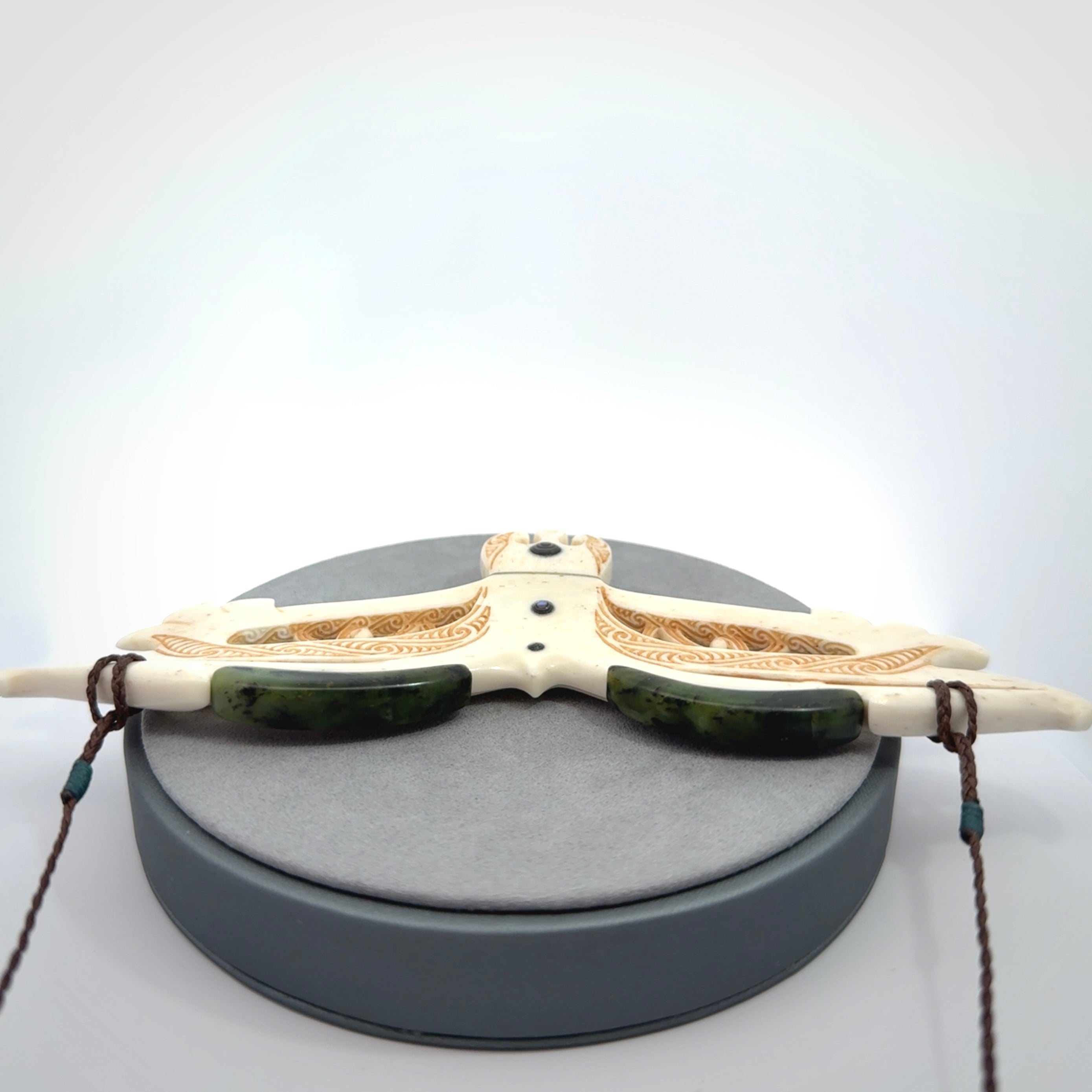 This is a wonderful New Zealand Jade and Bone necklace that can also be displayed as a sculpture with wooden stand.