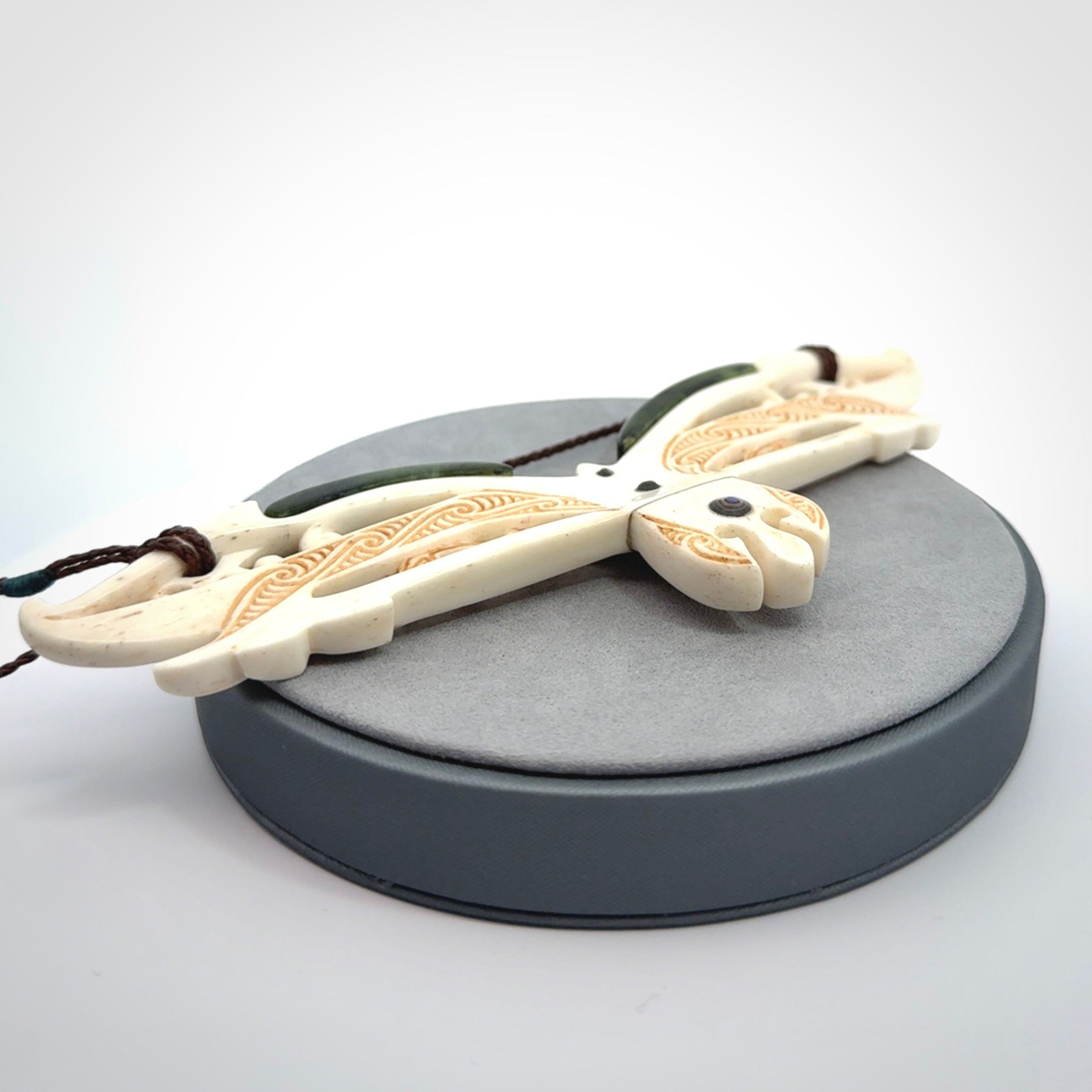 This is a wonderful New Zealand Jade and Bone necklace that can also be displayed as a sculpture with wooden stand.