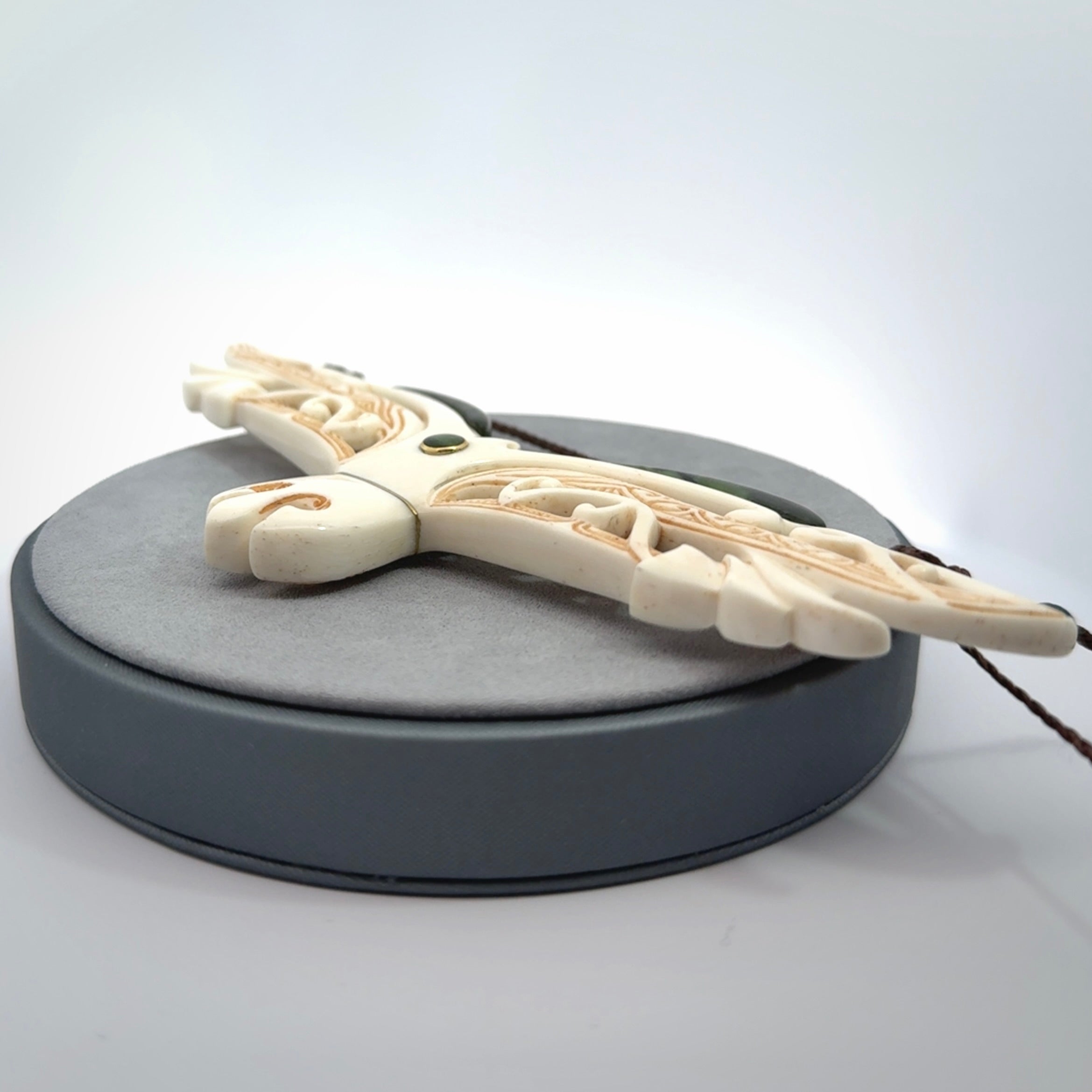 This is a wonderful New Zealand Jade and Bone necklace that can also be displayed as a sculpture with wooden stand.
