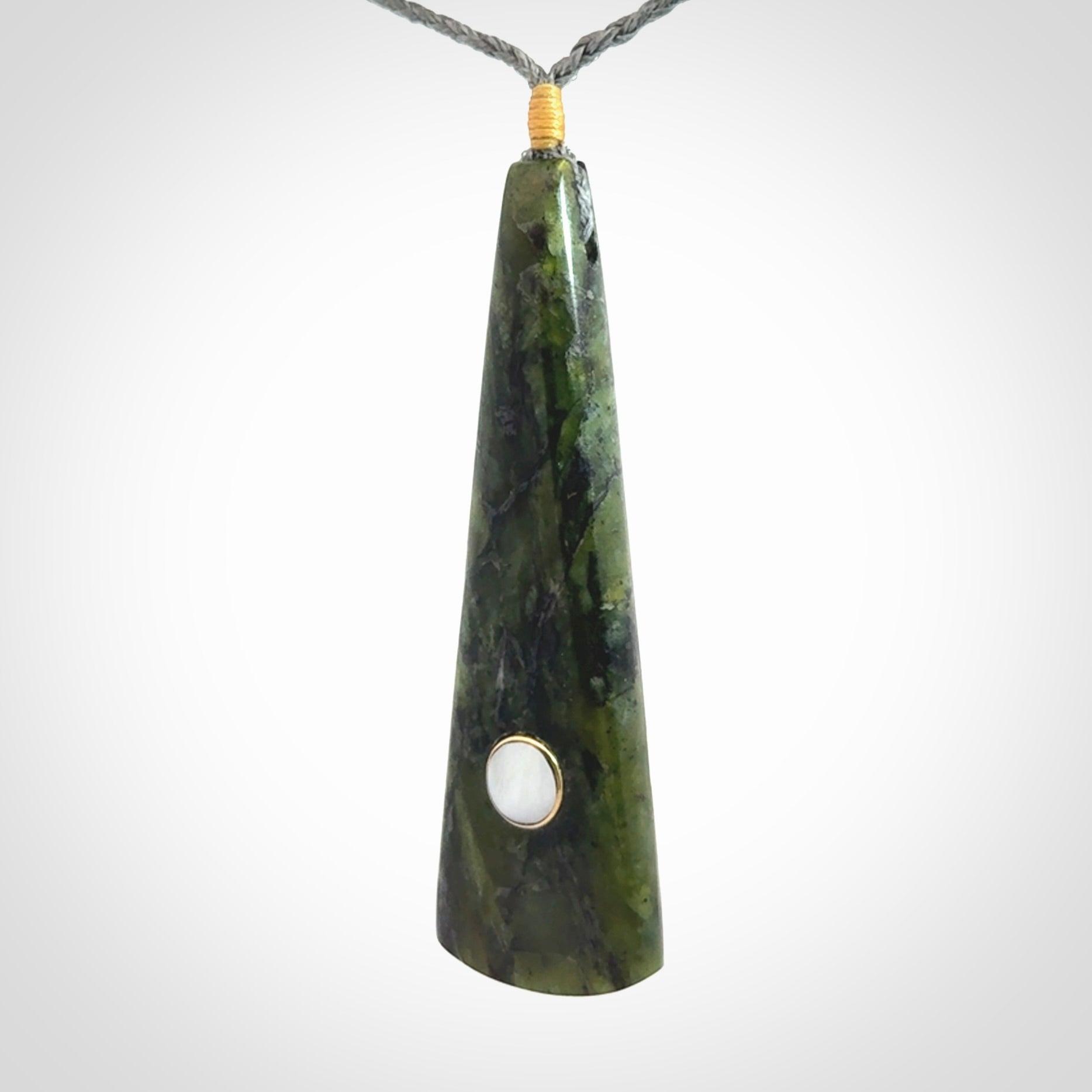 A Striking Jade Drop Pendant with Mother of Pearl and Brass inlay