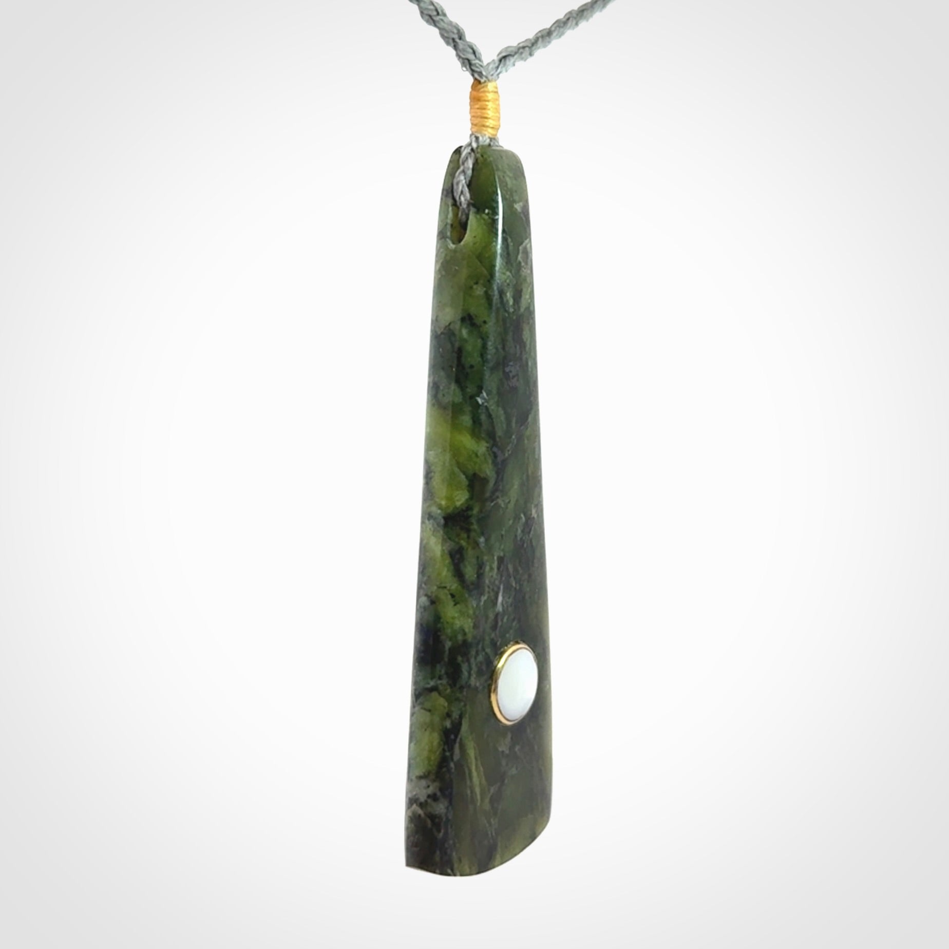 A Striking Jade Drop Pendant with Mother of Pearl and Brass inlay