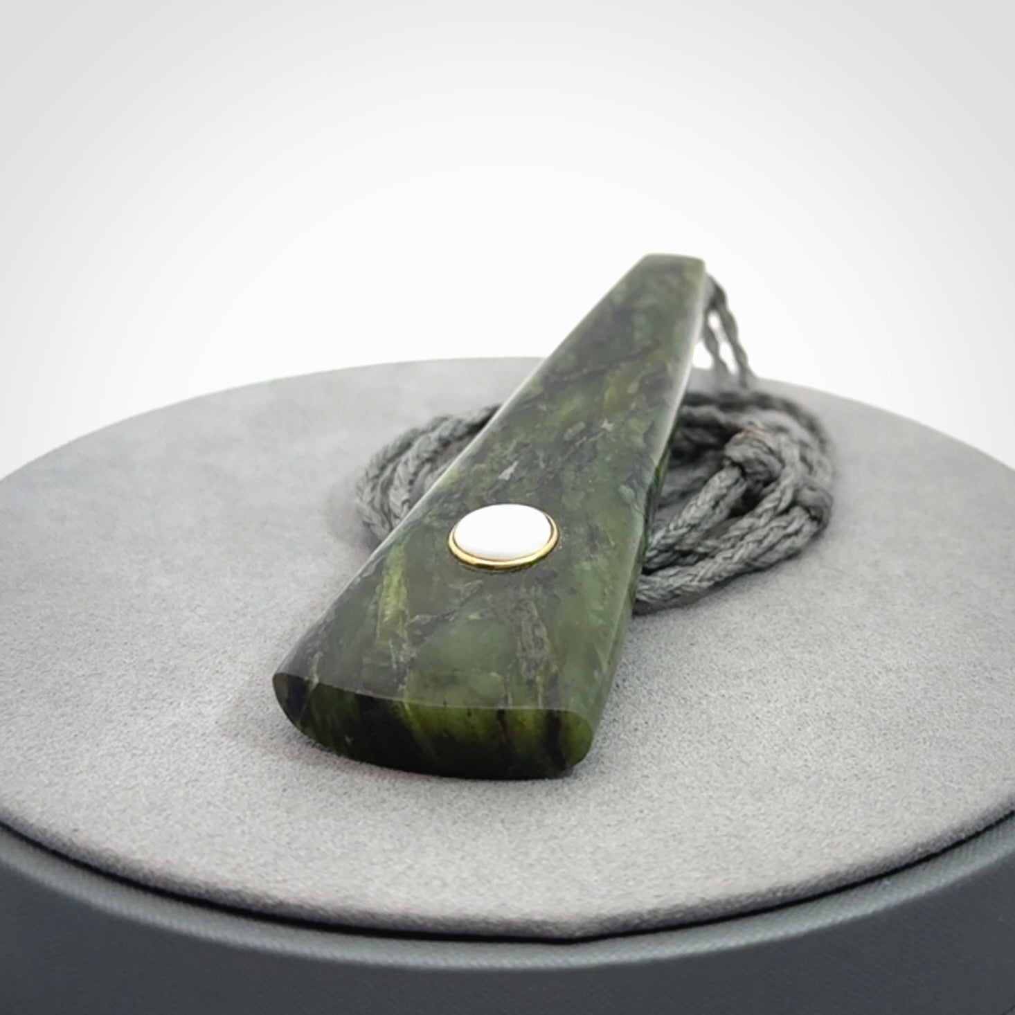 A Striking Jade Drop Pendant with Mother of Pearl and Brass inlay