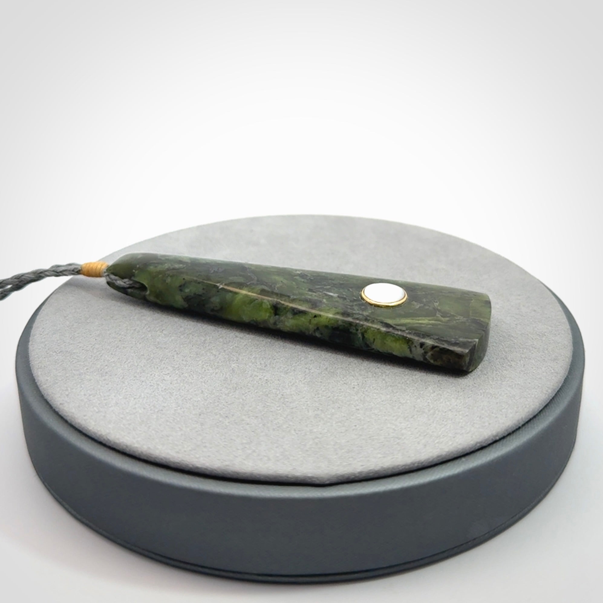 A Striking Jade Drop Pendant with Mother of Pearl and Brass inlay