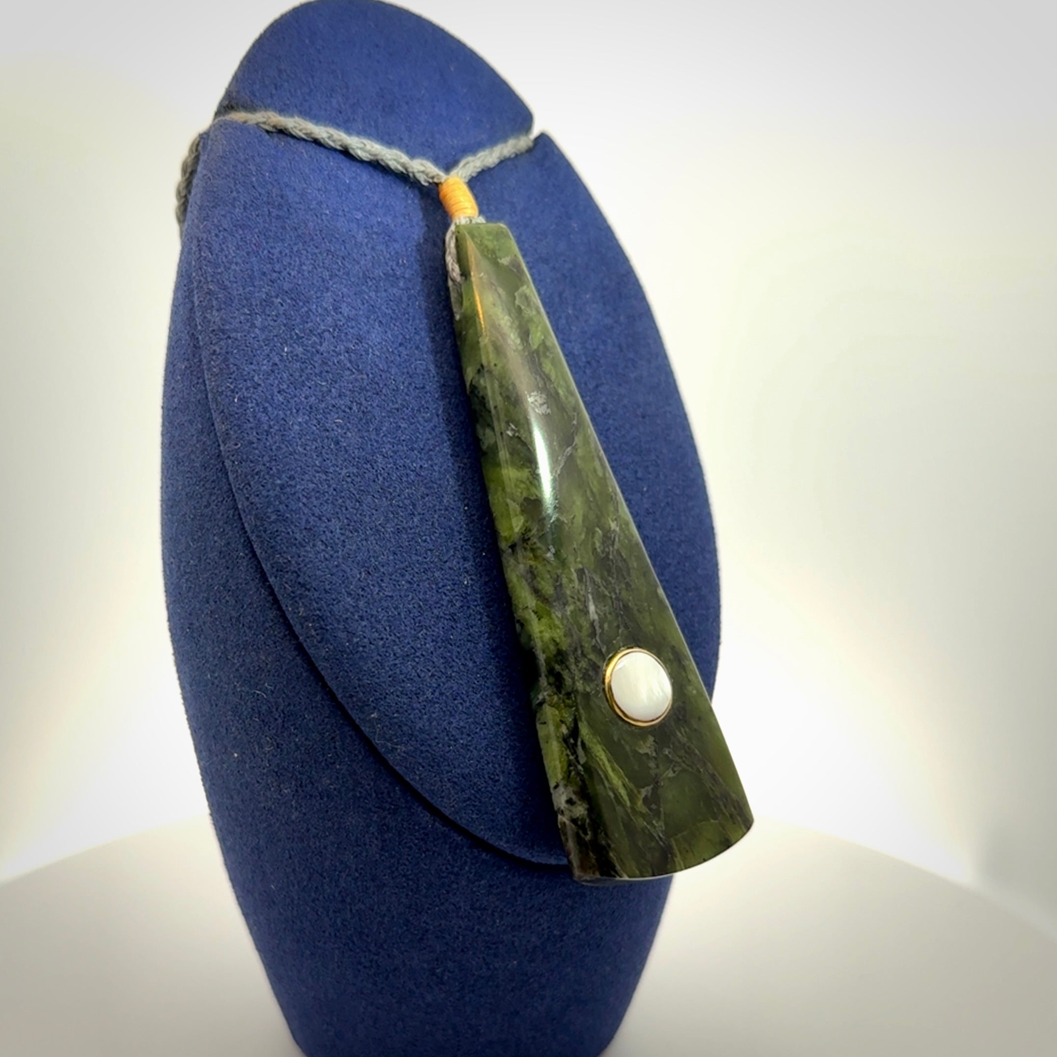 A Striking Jade Drop Pendant with Mother of Pearl and Brass inlay