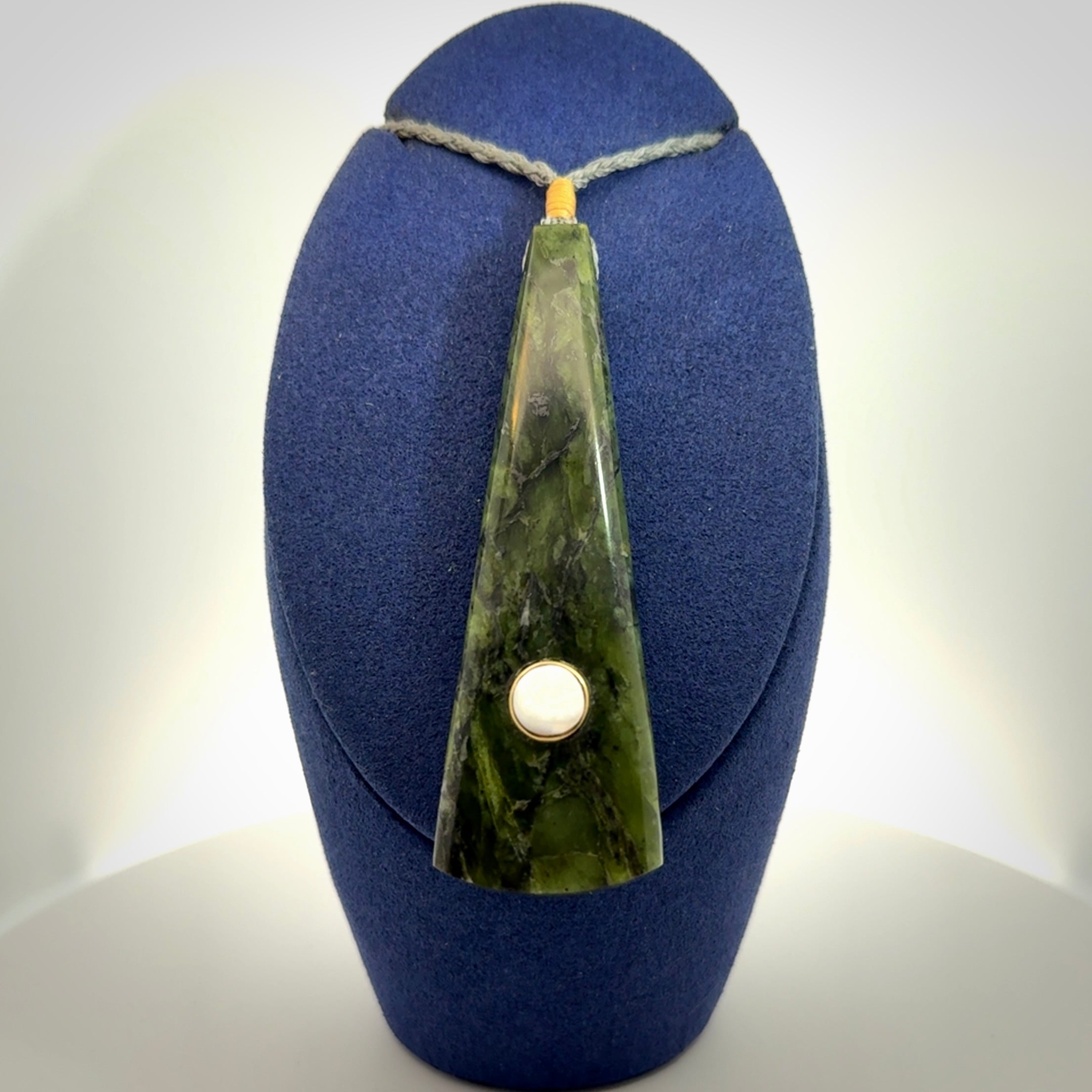 A Striking Jade Drop Pendant with Mother of Pearl and Brass inlay