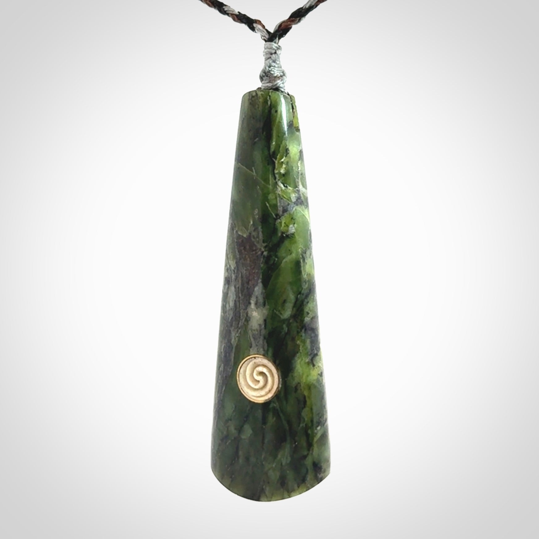 Hand carved New Zealand Jade drop pendant with whale bone koru inlay
