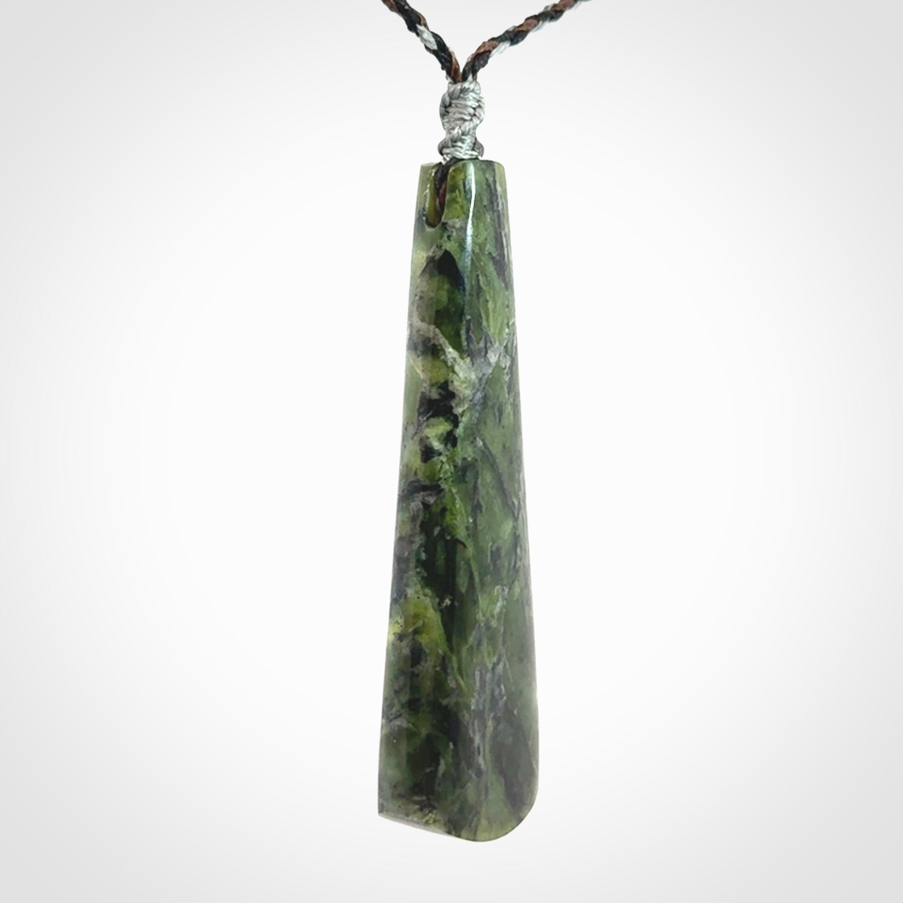 Hand carved New Zealand Jade drop pendant with whale bone koru inlay