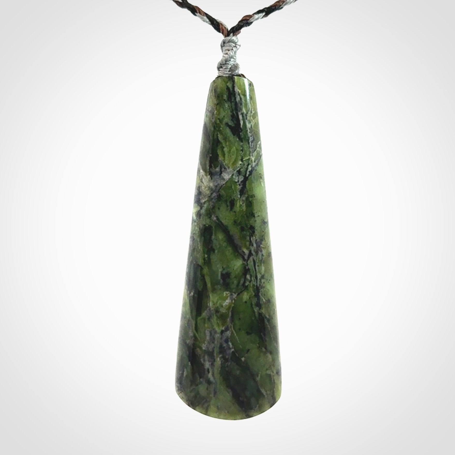 Hand carved New Zealand Jade drop pendant with whale bone koru inlay