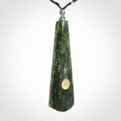 Hand carved New Zealand Jade drop pendant with whale bone koru inlay