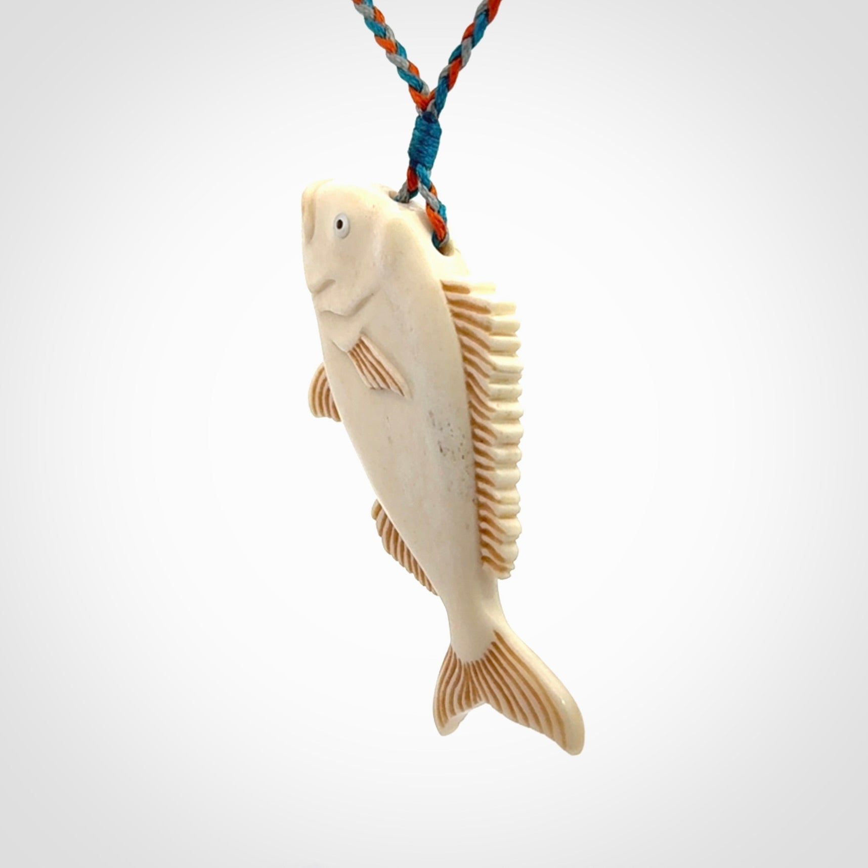A Beautifully Carved Bone Snapper Pendant