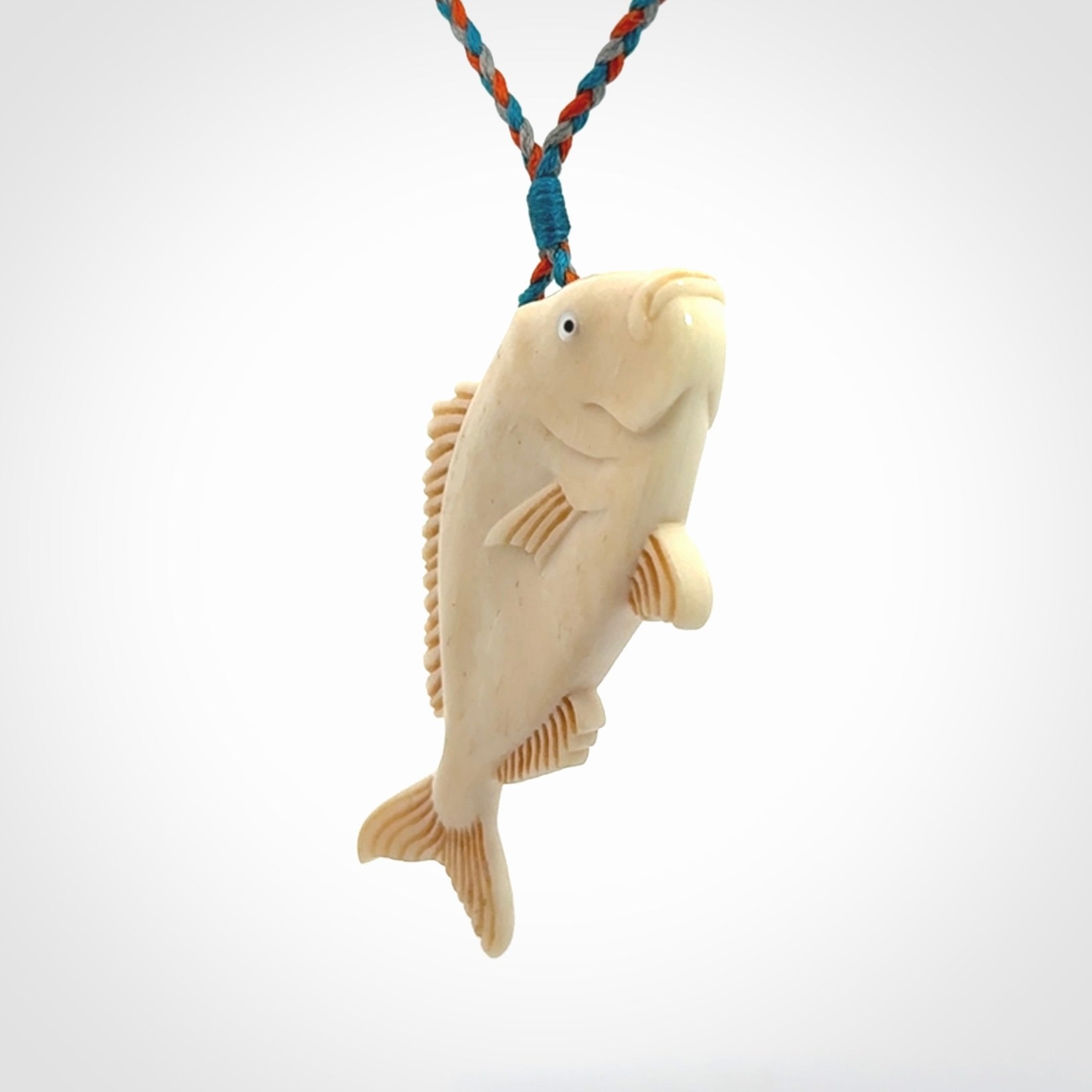 A Beautifully Carved Bone Snapper Pendant