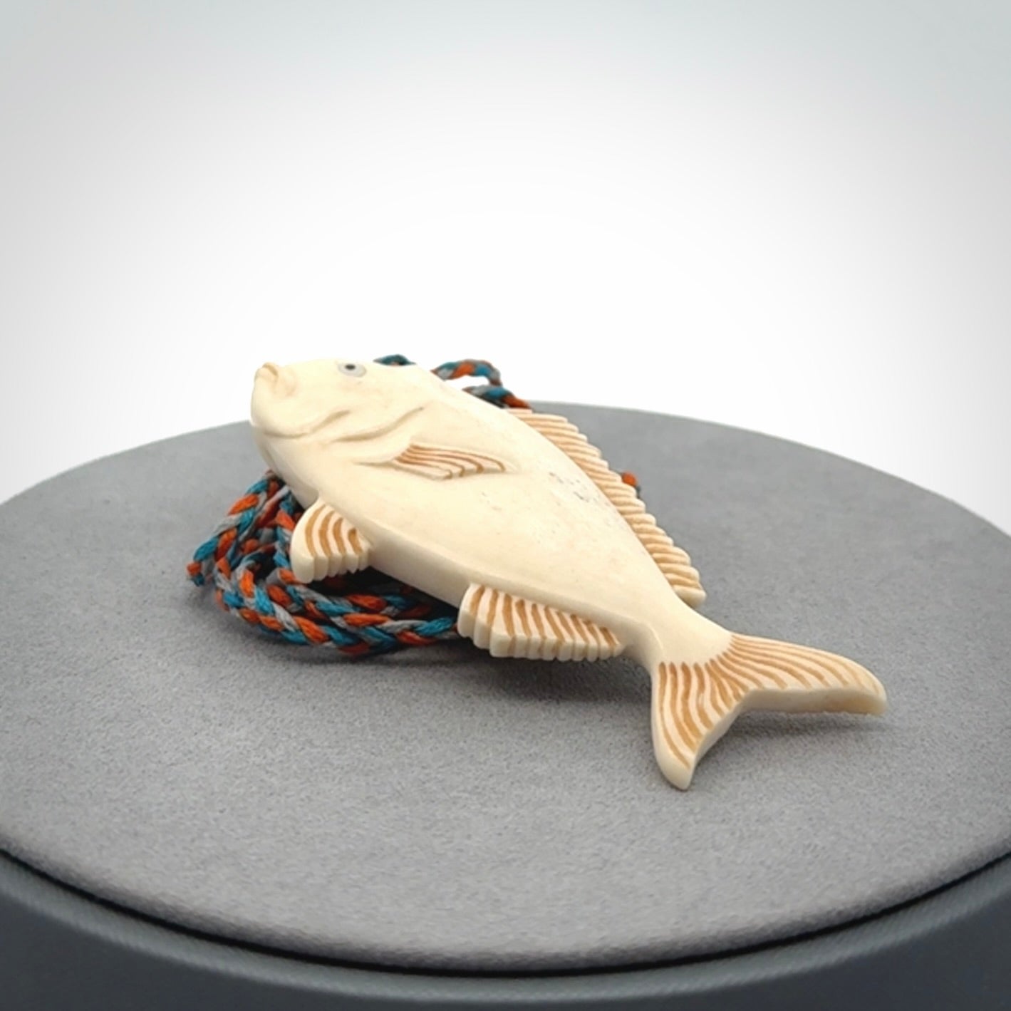 A Beautifully Carved Bone Snapper Pendant