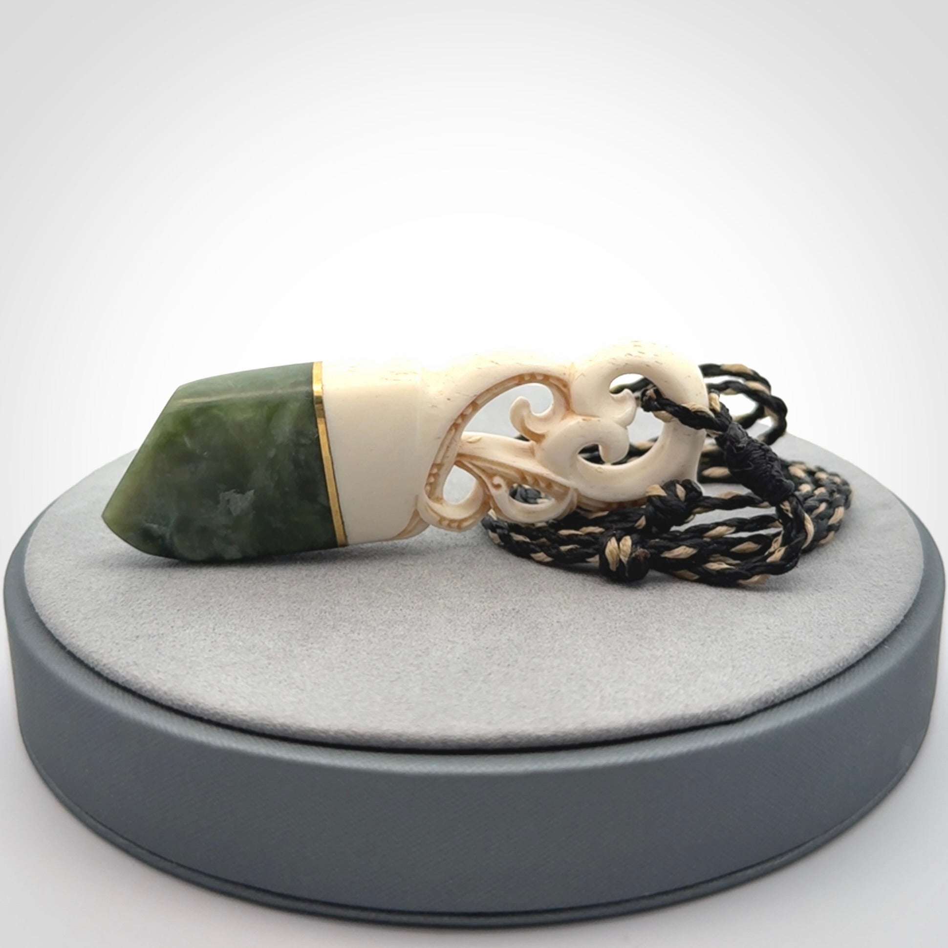 Hand carved Jade and bone pendant