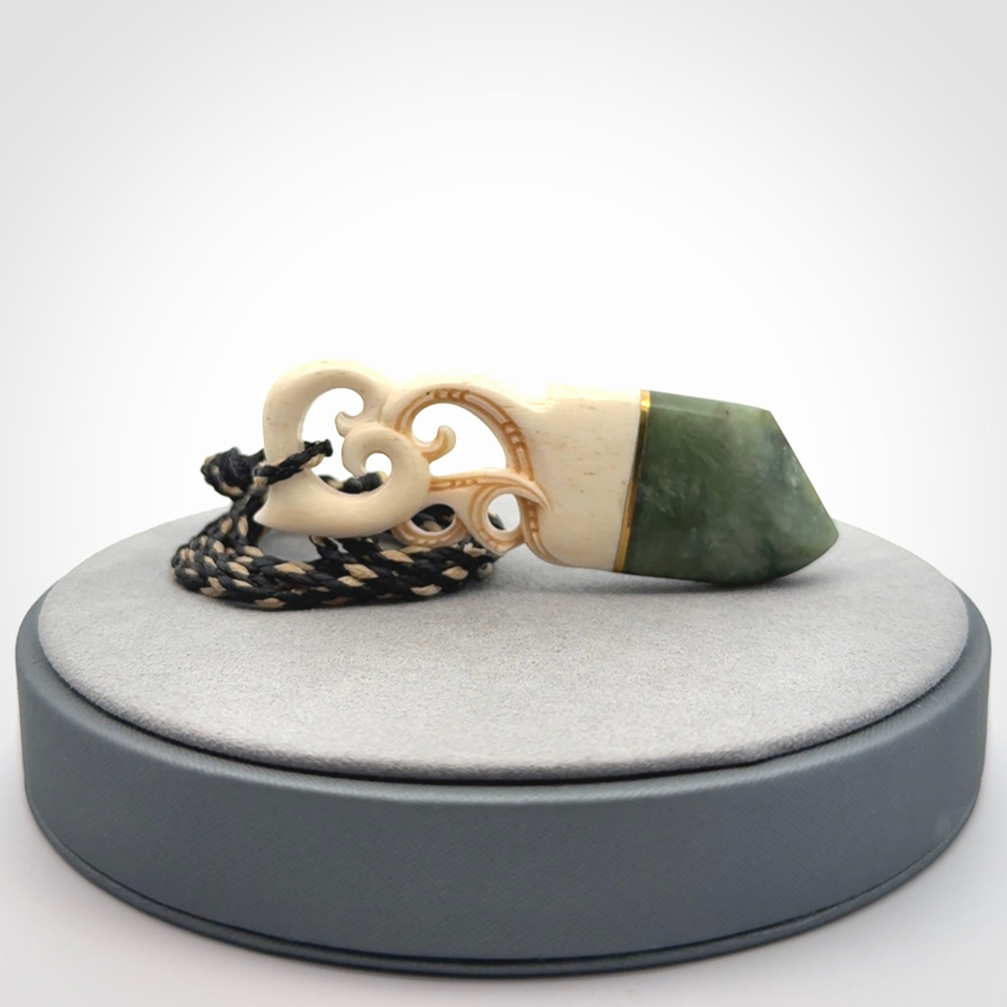 Hand carved Jade and bone pendant