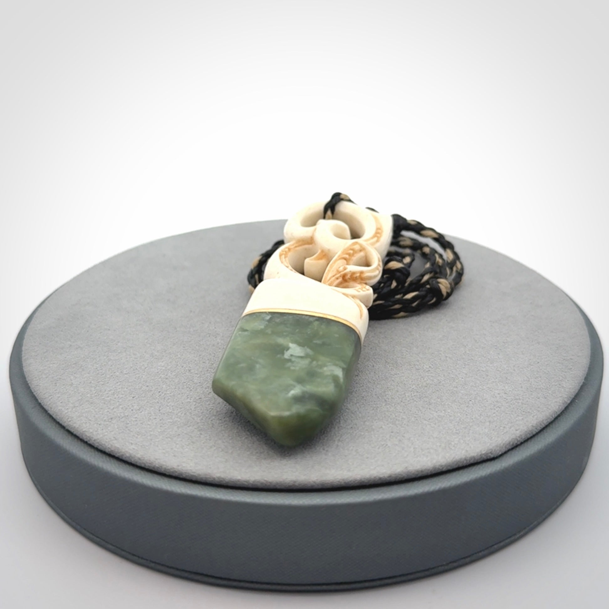 Hand carved Jade and bone pendant