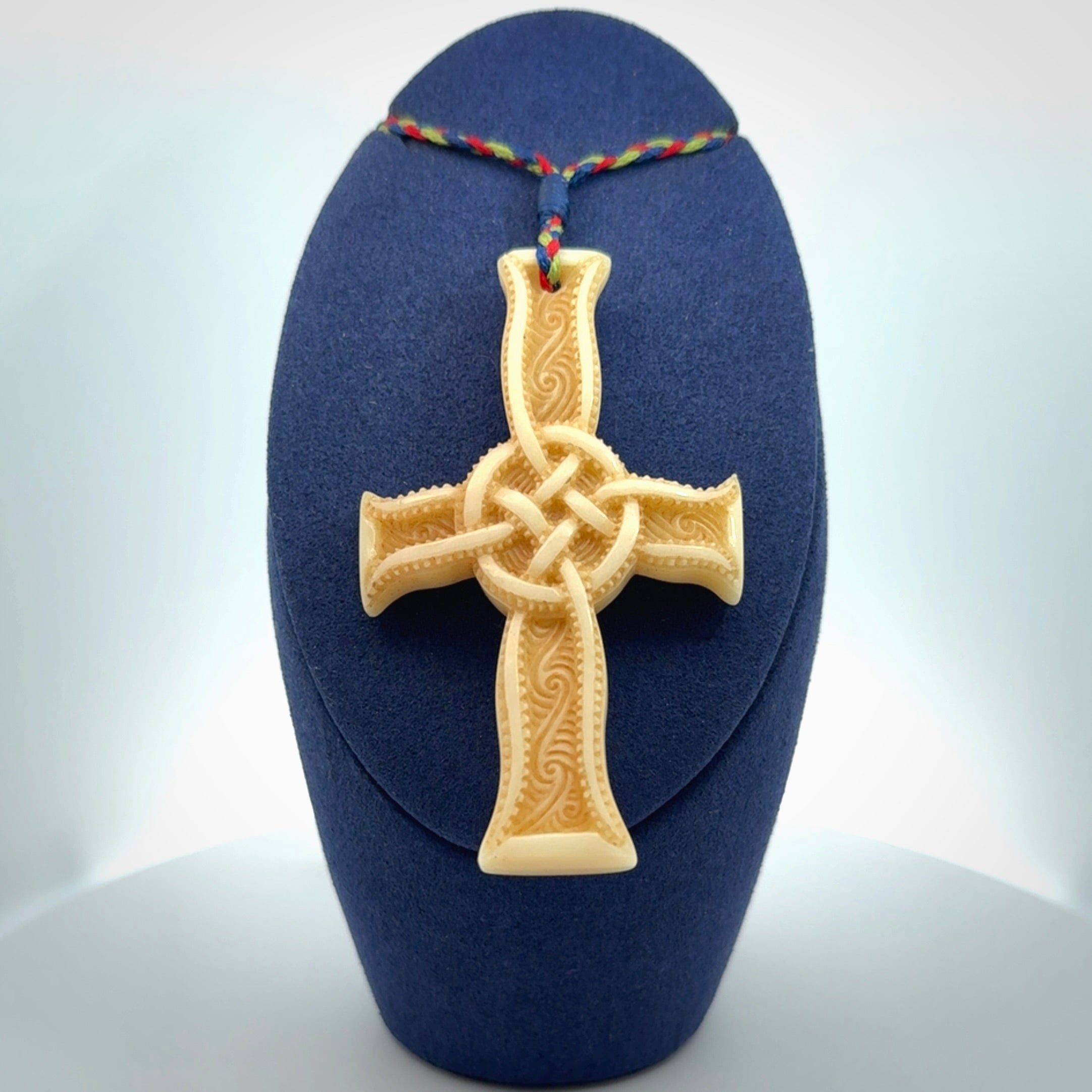 Hand carved bone Celtic cross pendant with jade inlay