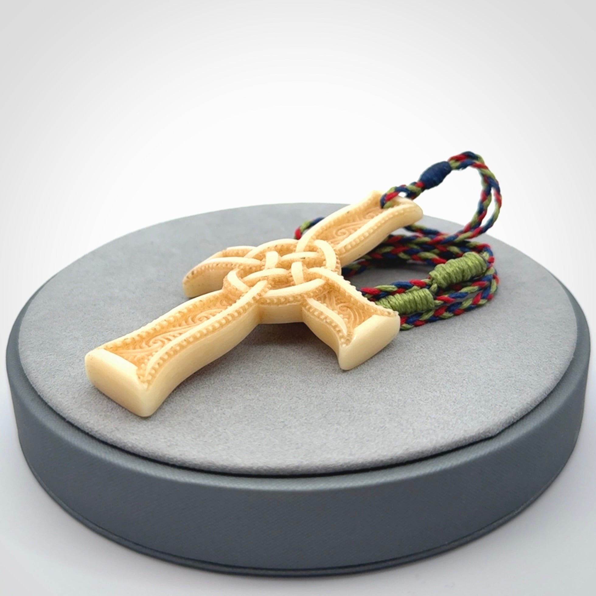 Hand carved bone Celtic cross pendant with jade inlay