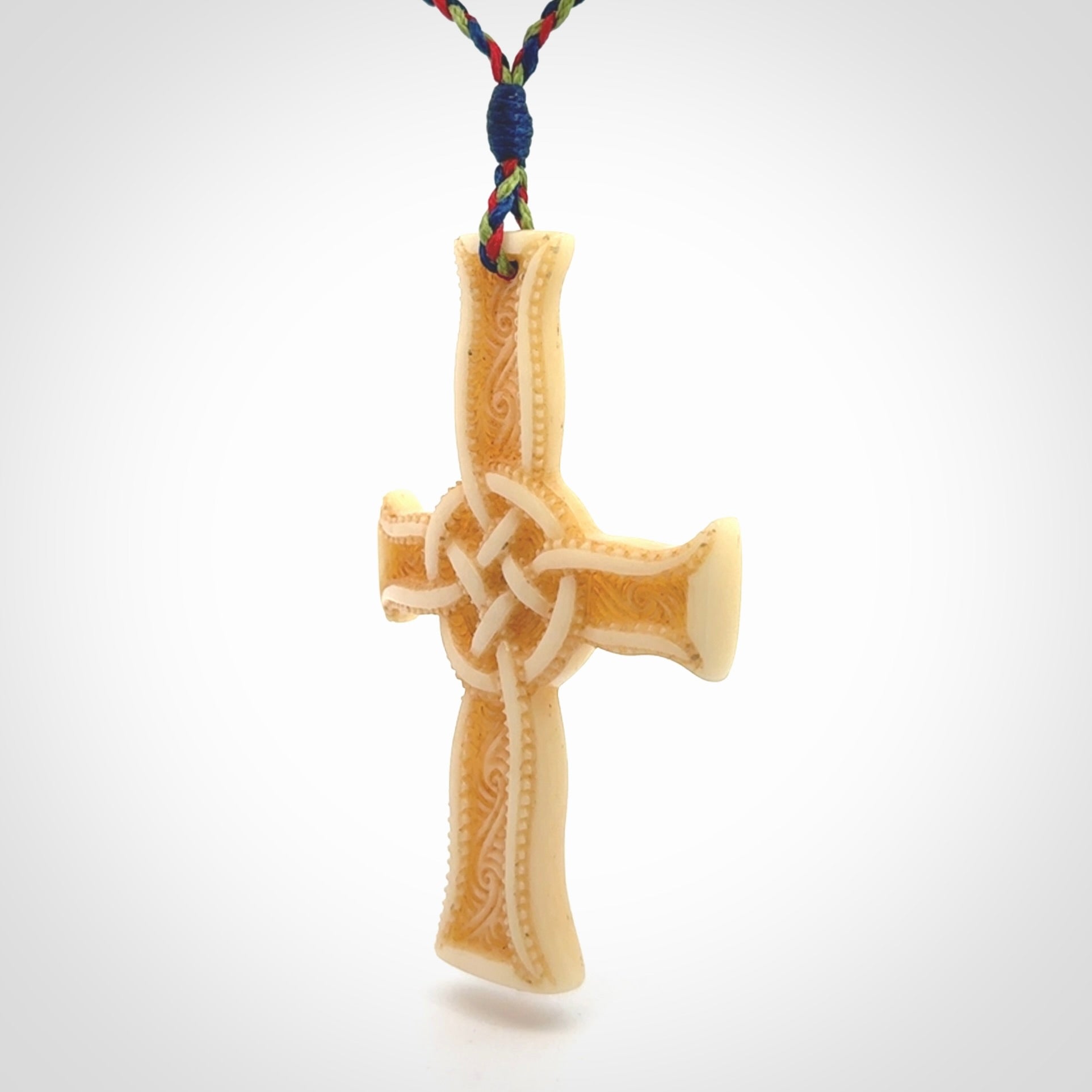 Hand carved bone Celtic cross pendant with jade inlay
