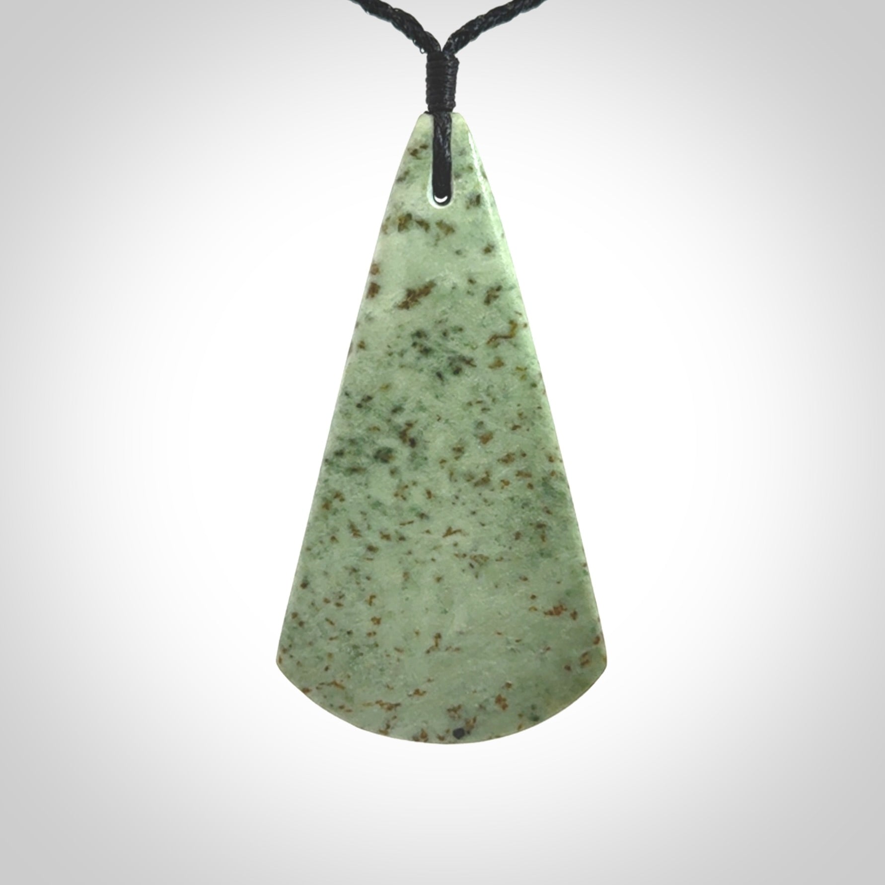 This is a wonderful New Zealand Jade and bone drop pendant with bird carving.