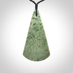 This is a wonderful New Zealand Jade and bone drop pendant with bird carving.