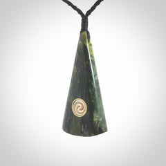 This is a wonderful New Zealand Jade drop pendant with whale bone koru and brass inlay.