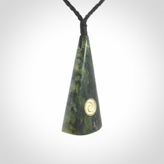 This is a wonderful New Zealand Jade drop pendant with whale bone koru and brass inlay.