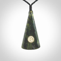 This is a wonderful New Zealand Jade drop pendant with whale bone koru and brass inlay.