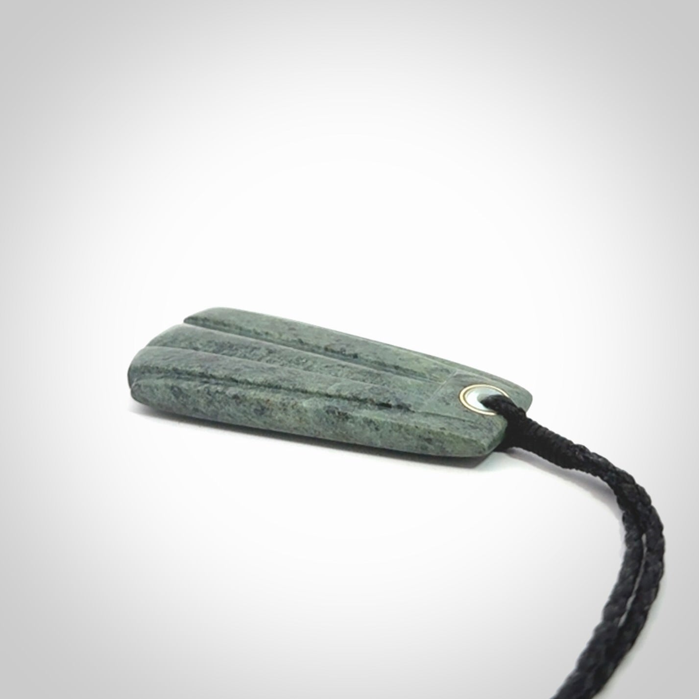 This is a wonderful New Zealand Jade Toki drop pendant.