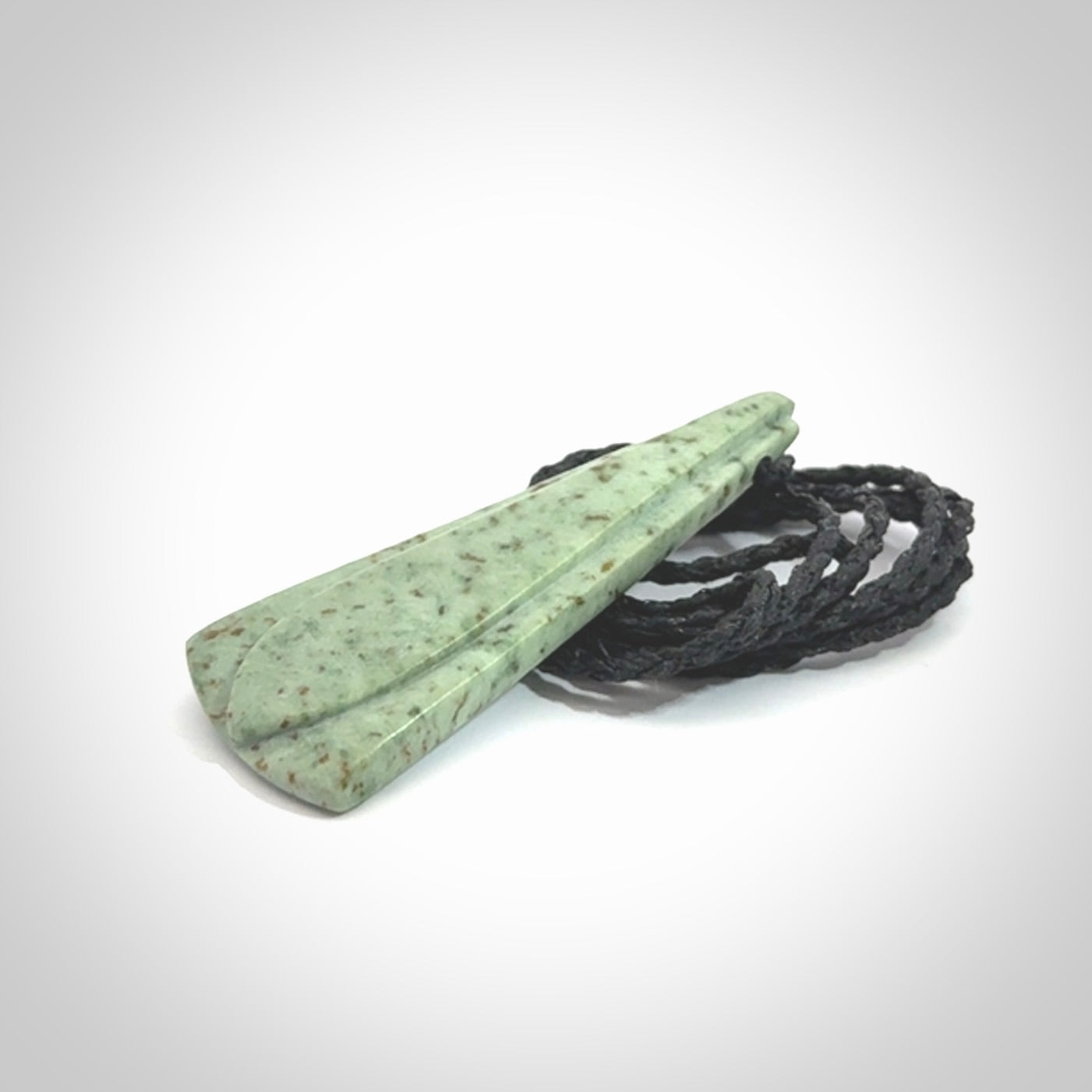 This is a wonderful New Zealand Kokopu Jade drop pendant.