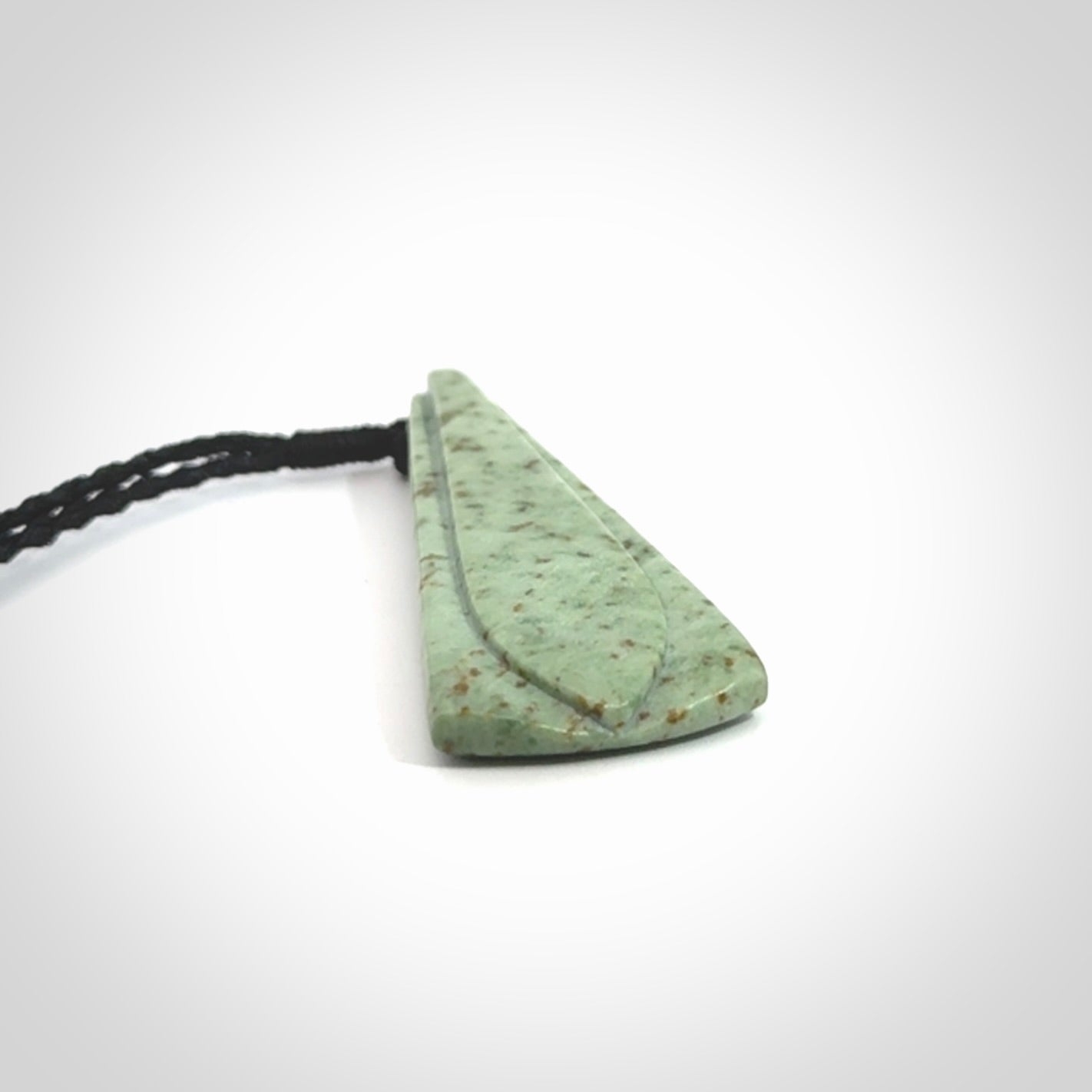 This is a wonderful New Zealand Kokopu Jade drop pendant.