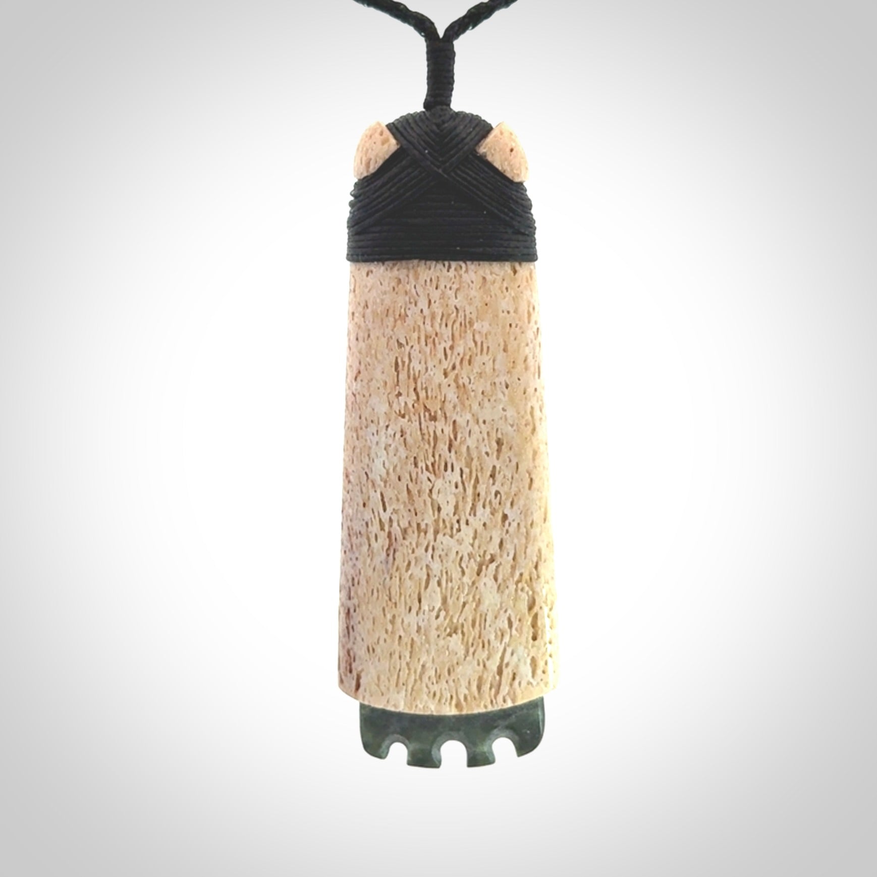 This is a wonderful large toki pendant. Hand made from whale bone and Jade. Delivered to you with an adjustable black cord.