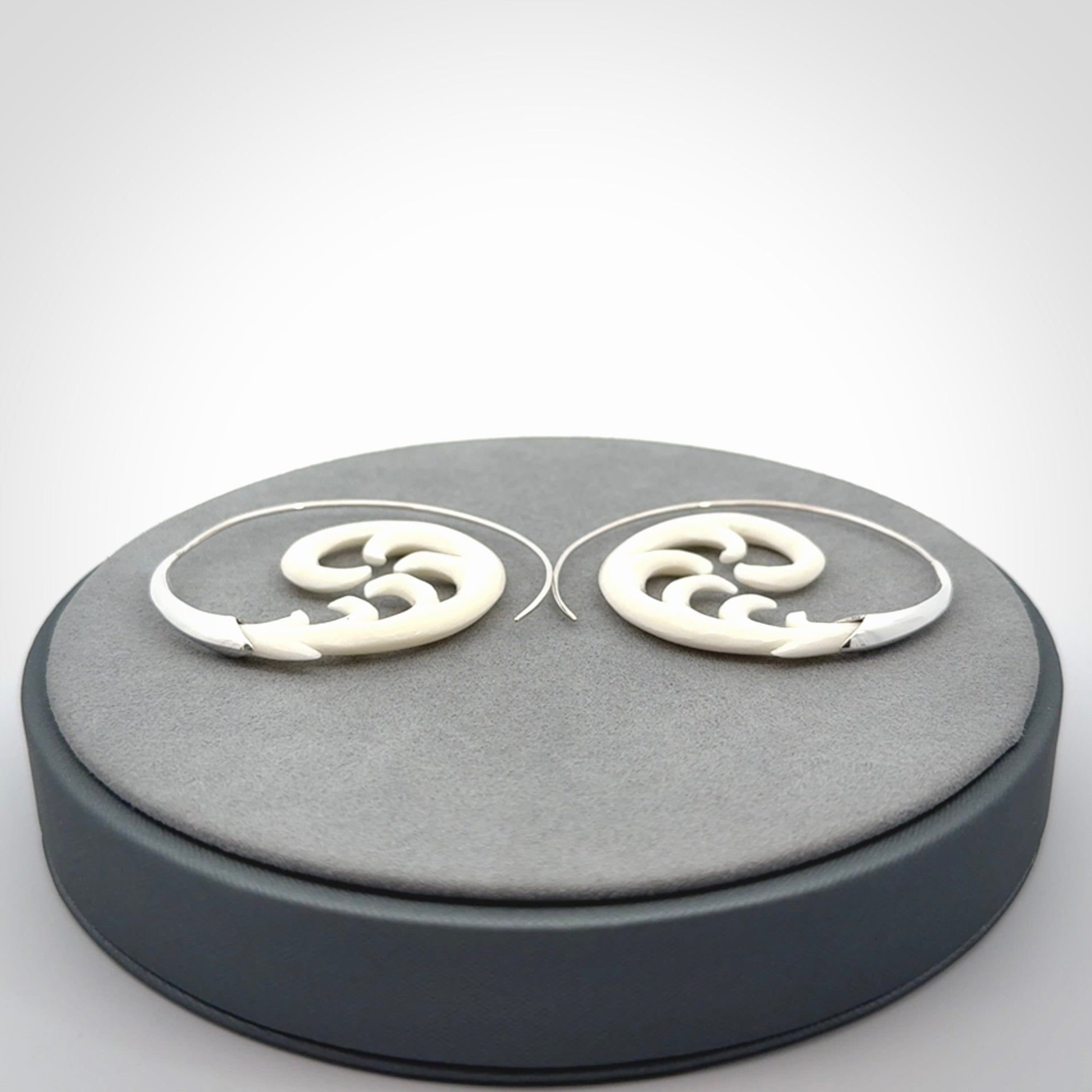 Hand carved earrings made from bone with sterling silver. NZ Pacific earrings for sale online.