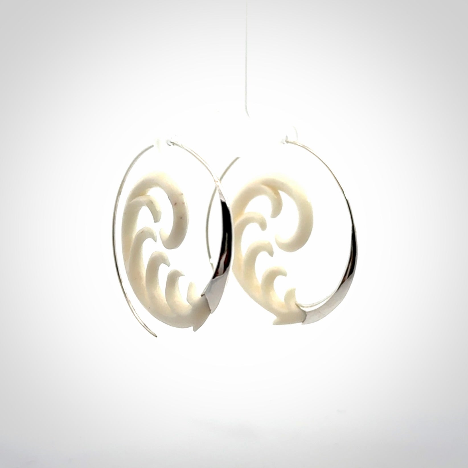 Hand carved earrings made from bone with sterling silver. NZ Pacific earrings for sale online.