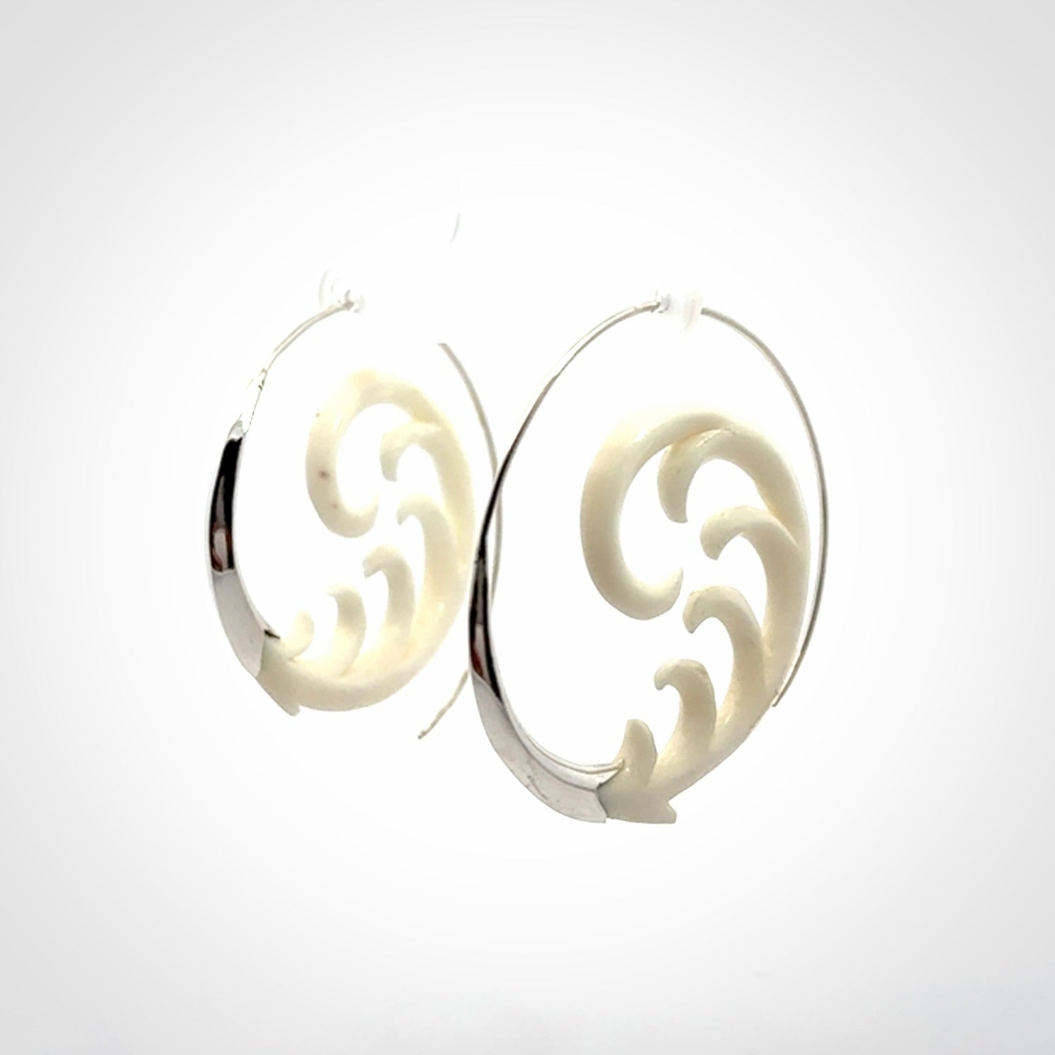 Hand carved earrings made from bone with sterling silver. NZ Pacific earrings for sale online.