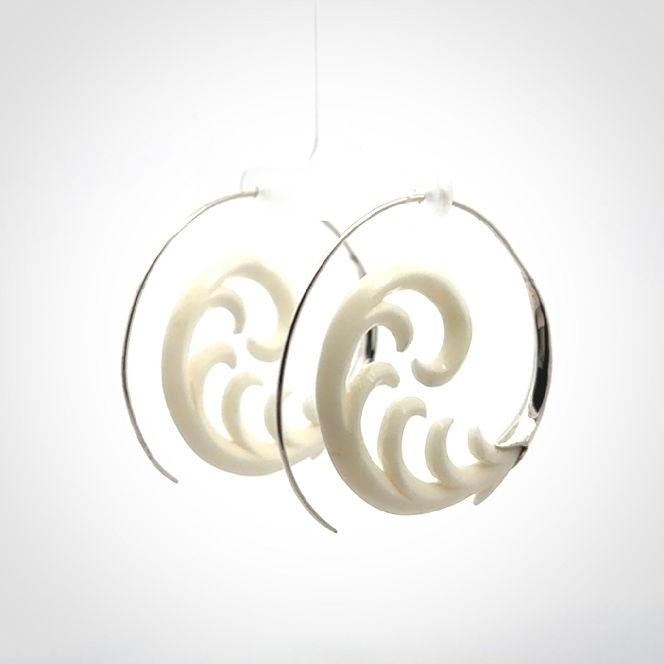 Hand carved earrings made from bone with sterling silver. NZ Pacific earrings for sale online.