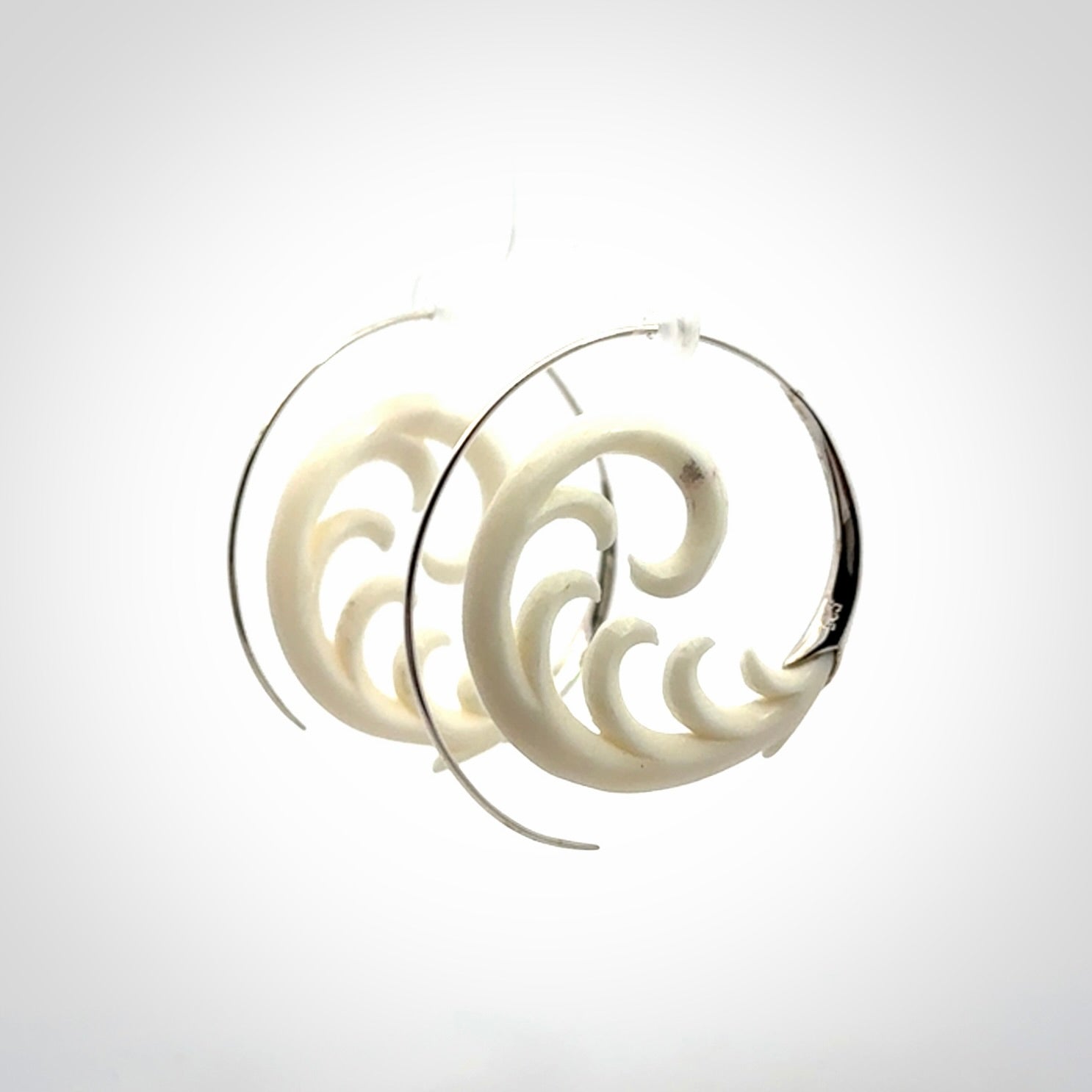 Hand carved earrings made from bone with sterling silver. NZ Pacific earrings for sale online.