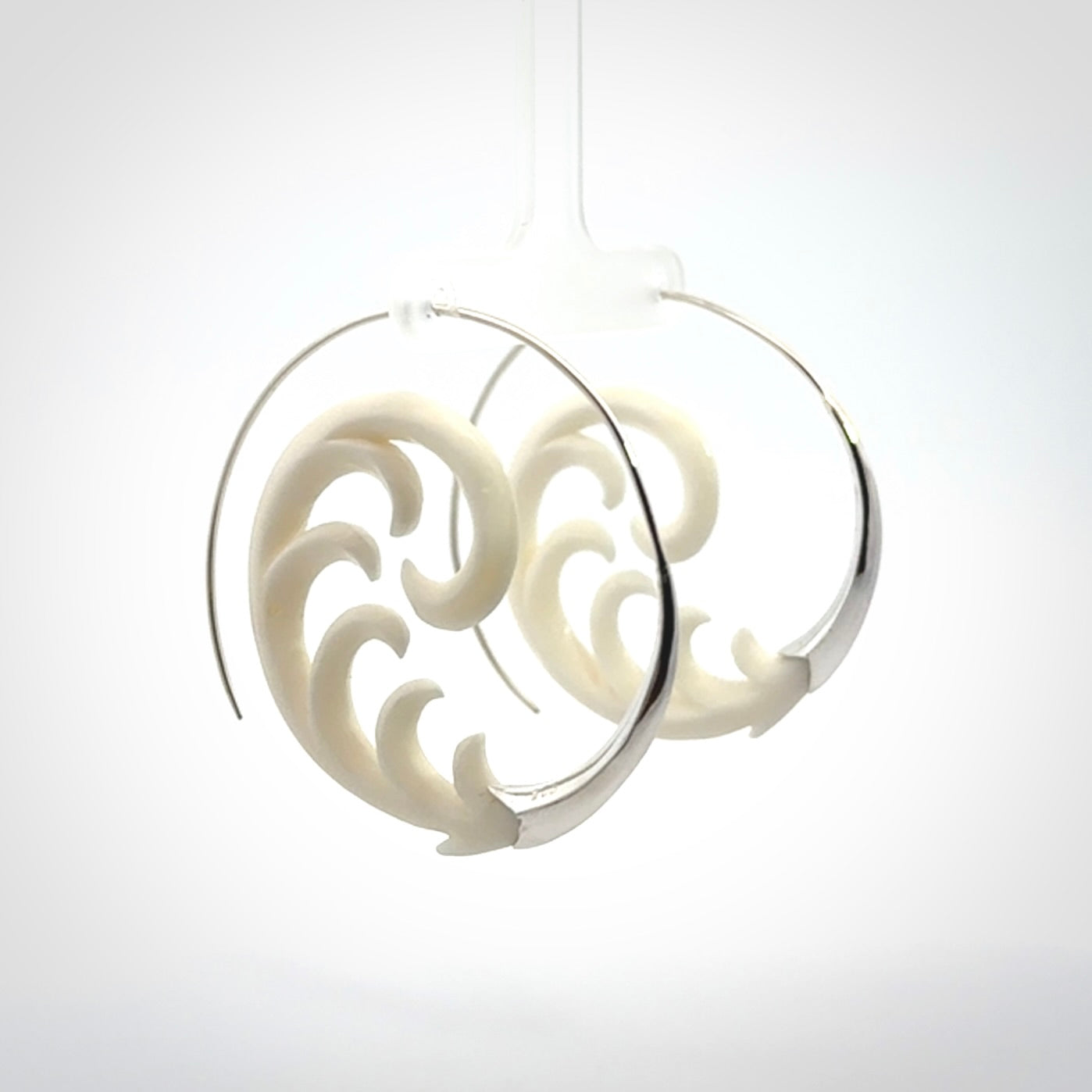 Hand carved earrings made from bone with sterling silver. NZ Pacific earrings for sale online.