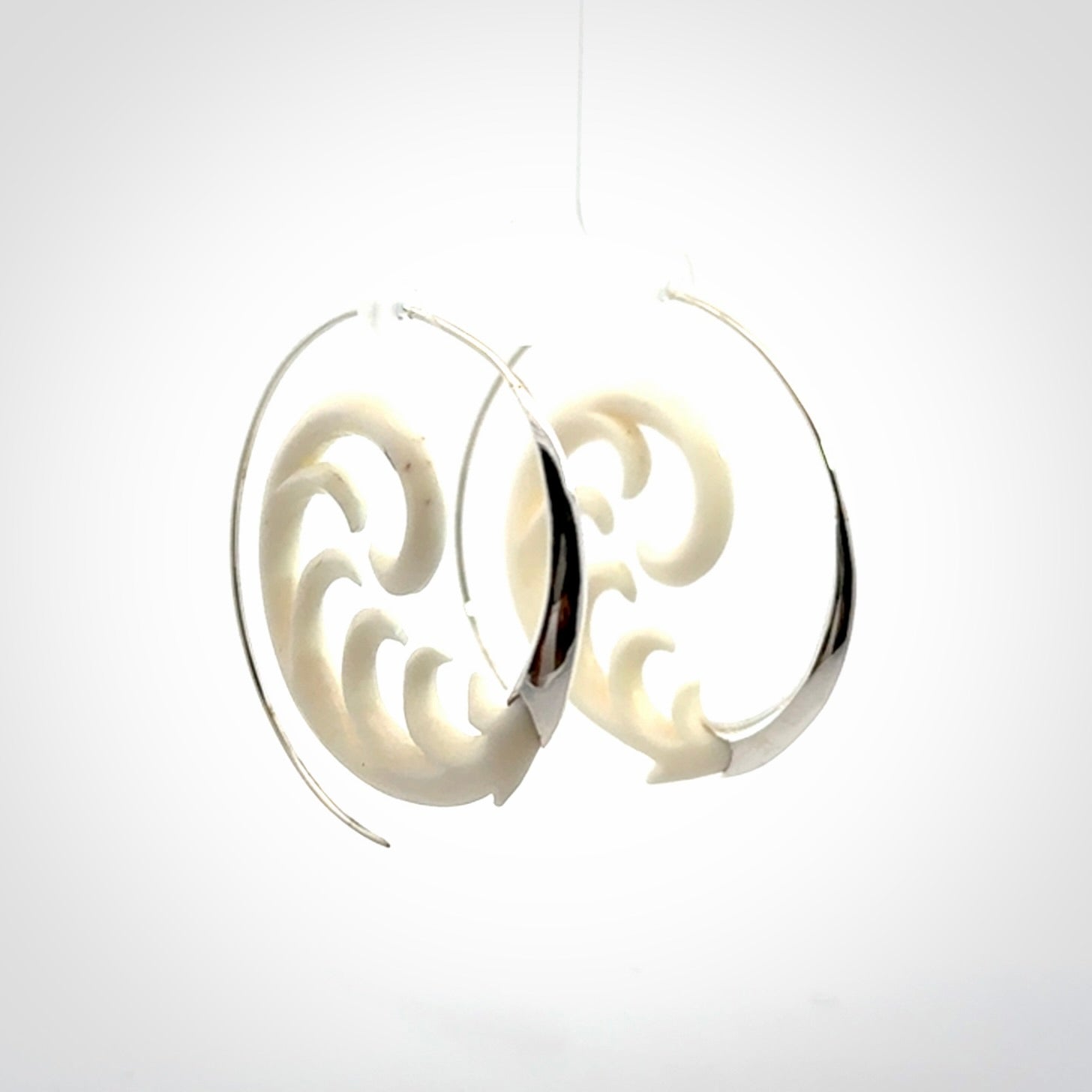 Hand carved earrings made from bone with sterling silver. NZ Pacific earrings for sale online.