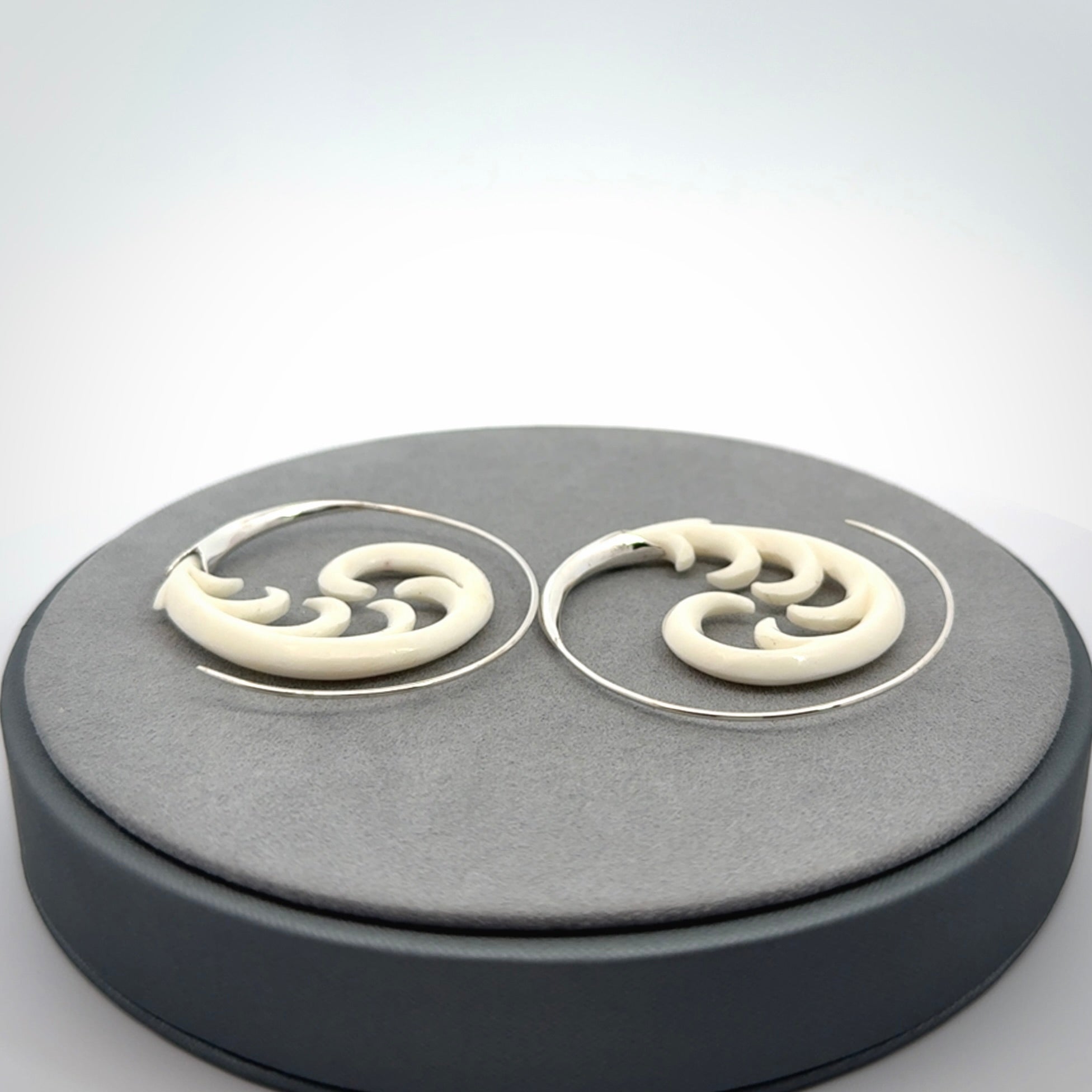 Hand carved earrings made from bone with sterling silver. NZ Pacific earrings for sale online.