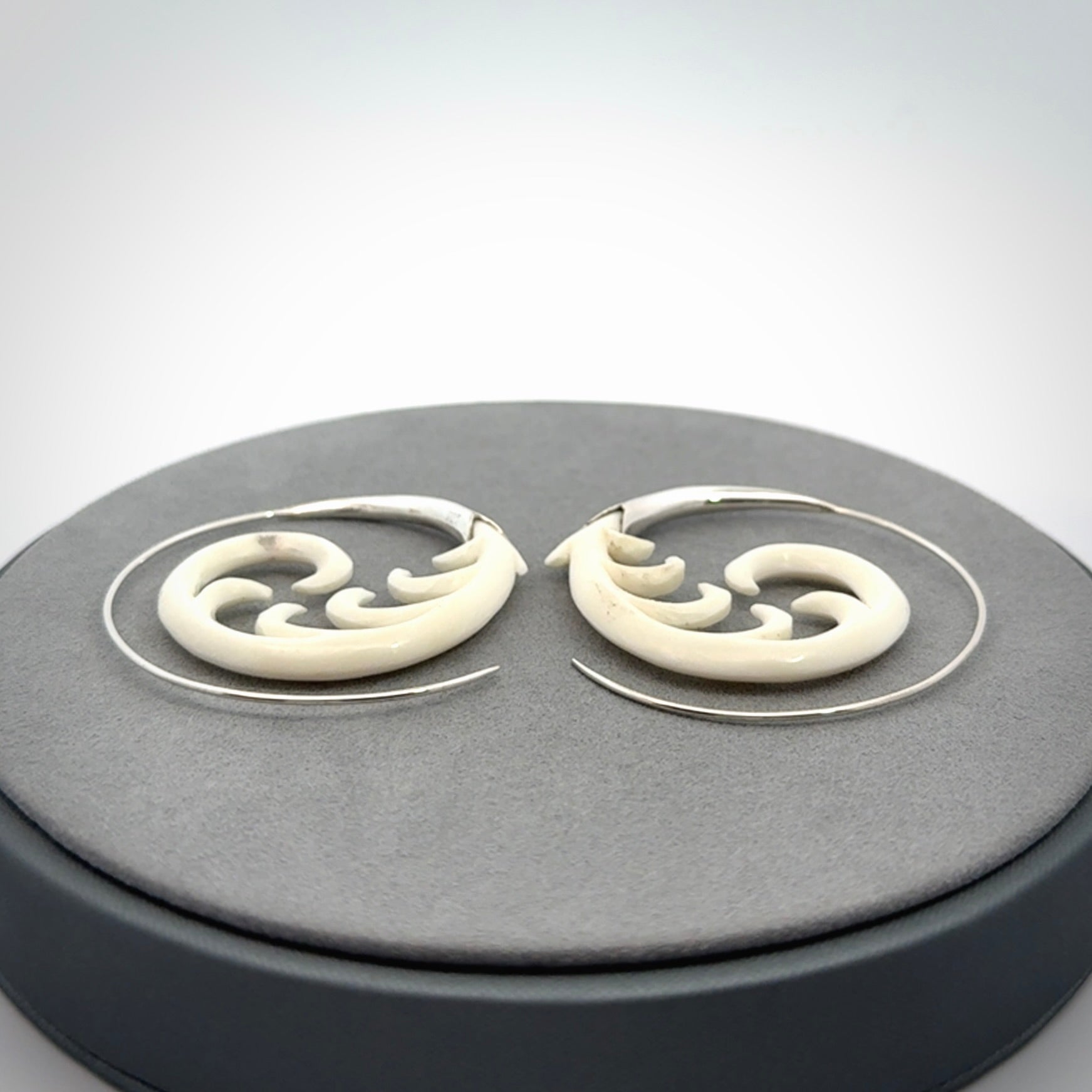 Hand carved earrings made from bone with sterling silver. NZ Pacific earrings for sale online.
