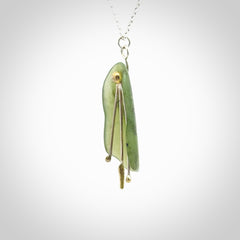 This kowhai flower drop pendant is beautifully hand made with gorgeous flair. It is fashionable and perfect for a women with style. Hand carved from a gorgeous piece of New Zealand jade with Gold leaf coating and sterling silver - this is an elegant and beautiful piece of art to wear.