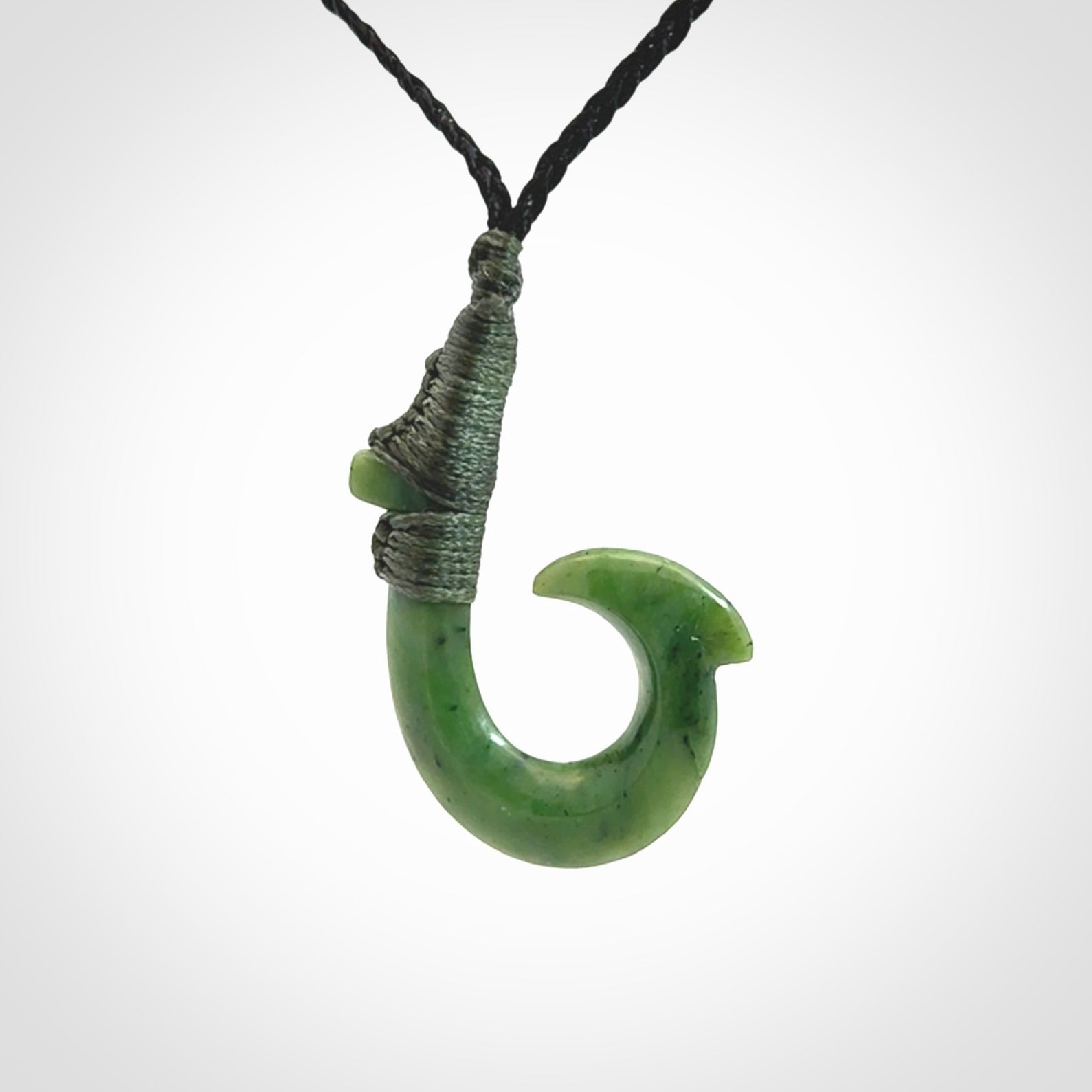 These pendants are hand carved, green jade Hawaiian hooks or Makau pendants. They are beautifully finished in a high polish and bound with an adjustable cord. Hand made jewellery that make the most wonderful gifts. Free shipping worldwide.