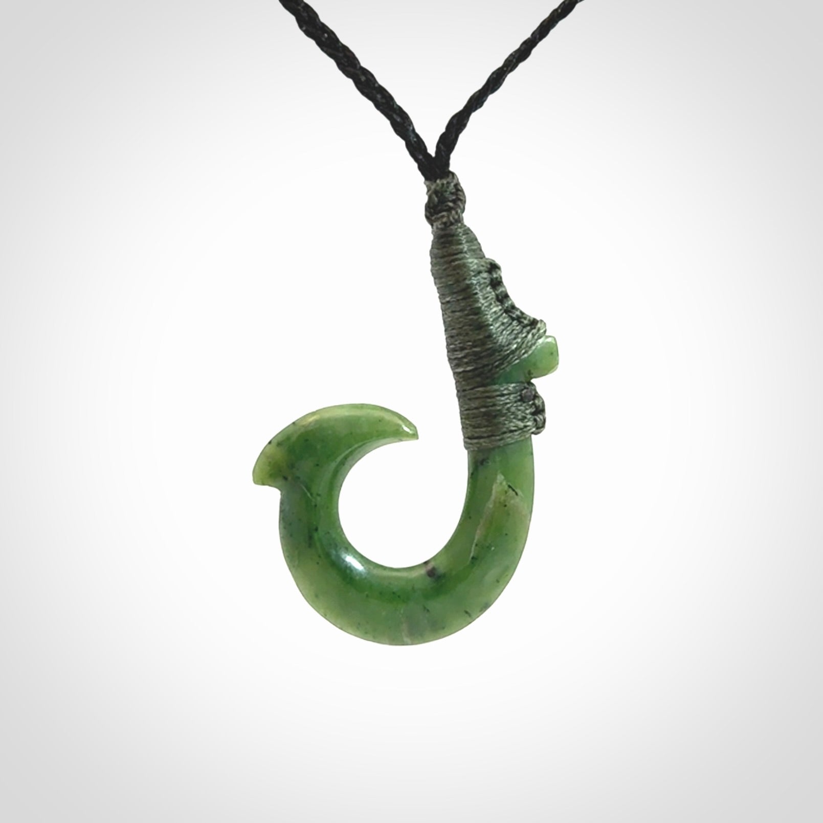 These pendants are hand carved, green jade Hawaiian hooks or Makau pendants. They are beautifully finished in a high polish and bound with an adjustable cord. Hand made jewellery that make the most wonderful gifts. Free shipping worldwide.