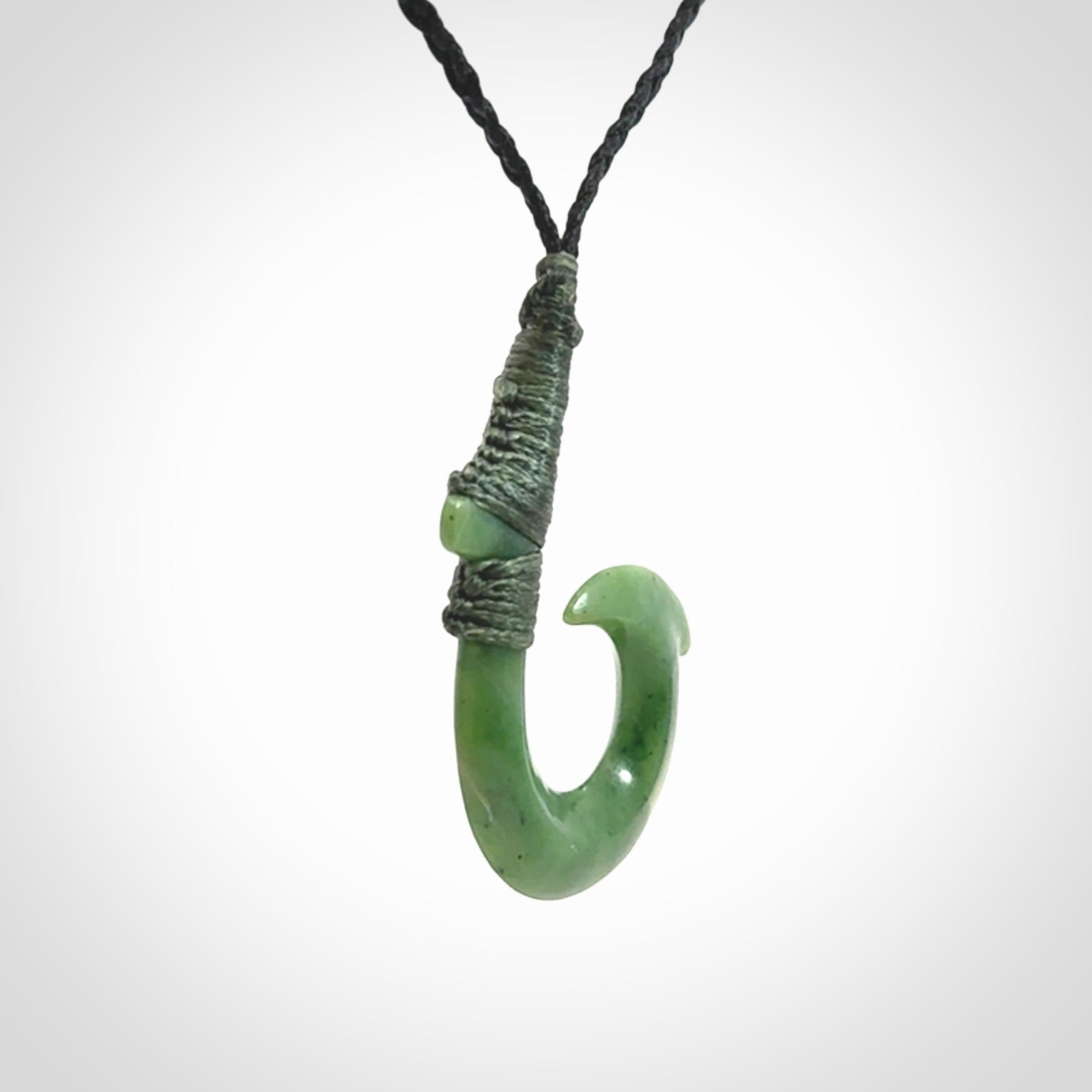 These pendants are hand carved, green jade Hawaiian hooks or Makau pendants. They are beautifully finished in a high polish and bound with an adjustable cord. Hand made jewellery that make the most wonderful gifts. Free shipping worldwide.