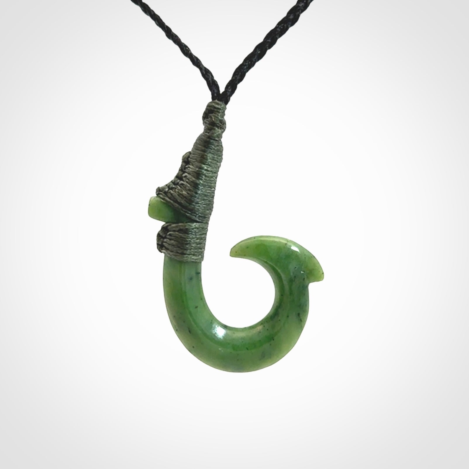 These pendants are hand carved, green jade Hawaiian hooks or Makau pendants. They are beautifully finished in a high polish and bound with an adjustable cord. Hand made jewellery that make the most wonderful gifts. Free shipping worldwide.