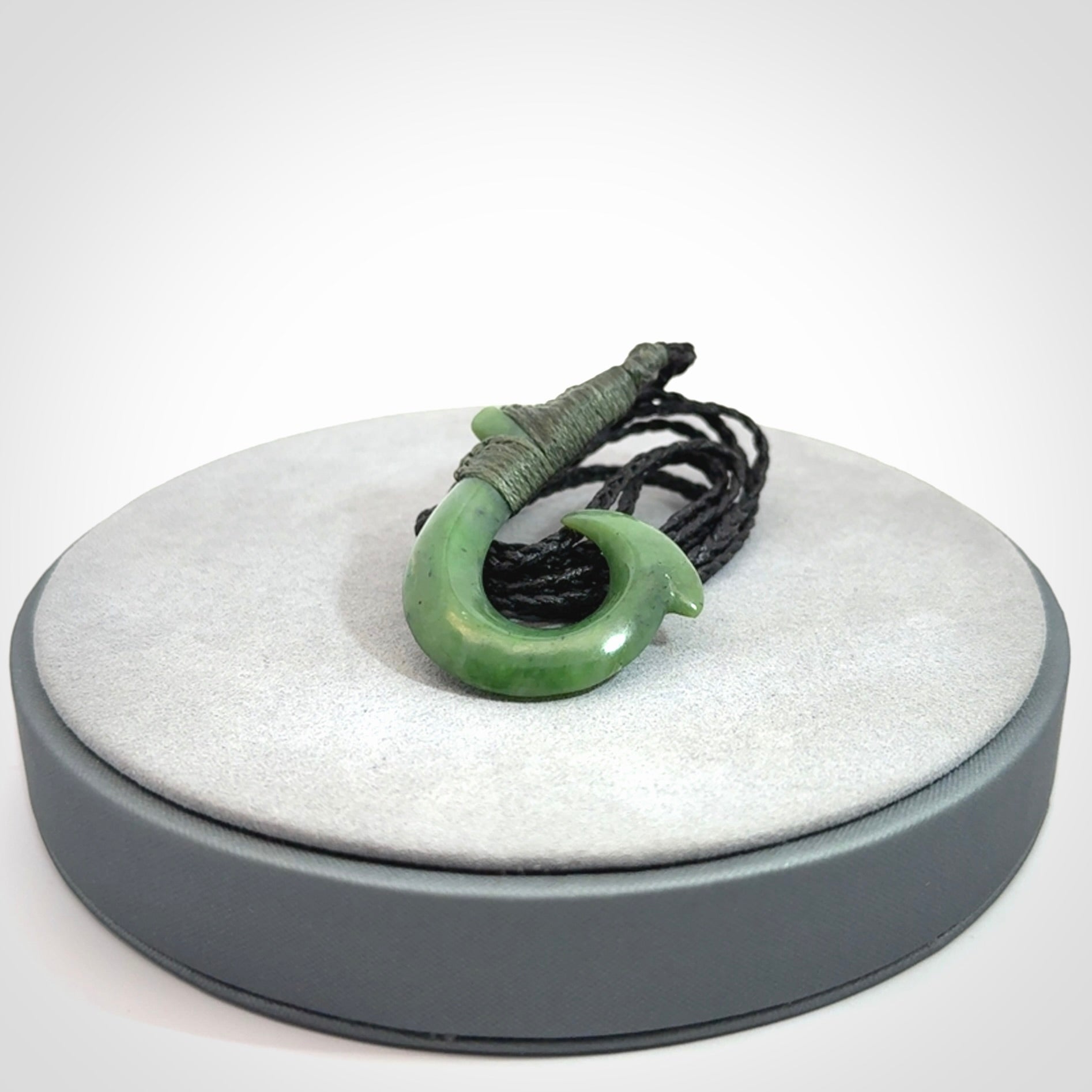 These pendants are hand carved, green jade Hawaiian hooks or Makau pendants. They are beautifully finished in a high polish and bound with an adjustable cord. Hand made jewellery that make the most wonderful gifts. Free shipping worldwide.