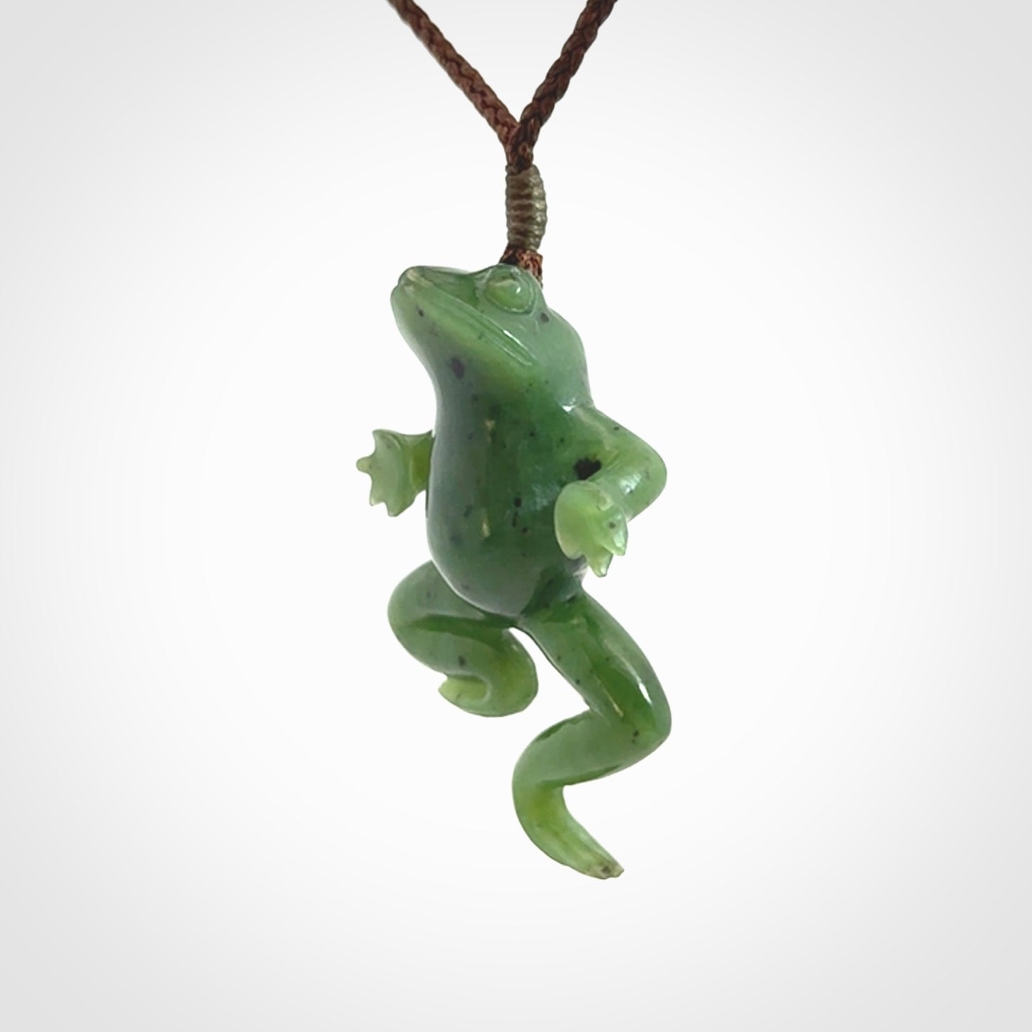 A hand carved jade frog pendant - he's carved to make you smile!